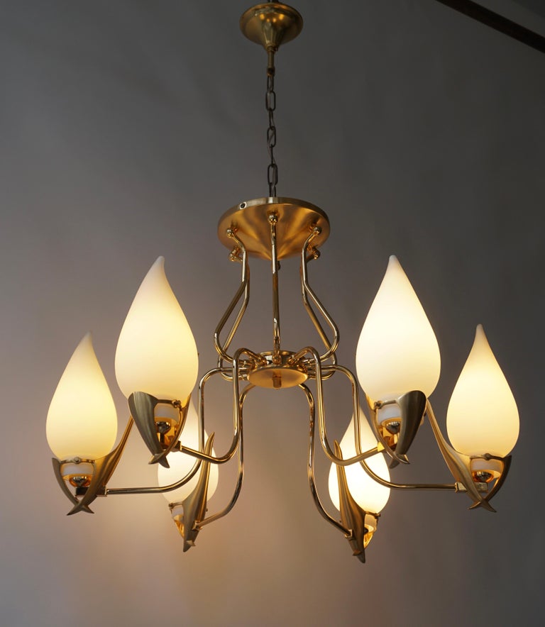 Elegant chandelier with six opaline glass lampshades supported by a gold-plated hardware by Franco Luce, Murano, Italy, 1970s.

Diameter 25 inch - 64 cm.
height fixture 19 inch - 48 cm.
Total height including the chain and ceiling plate is 33 inch -