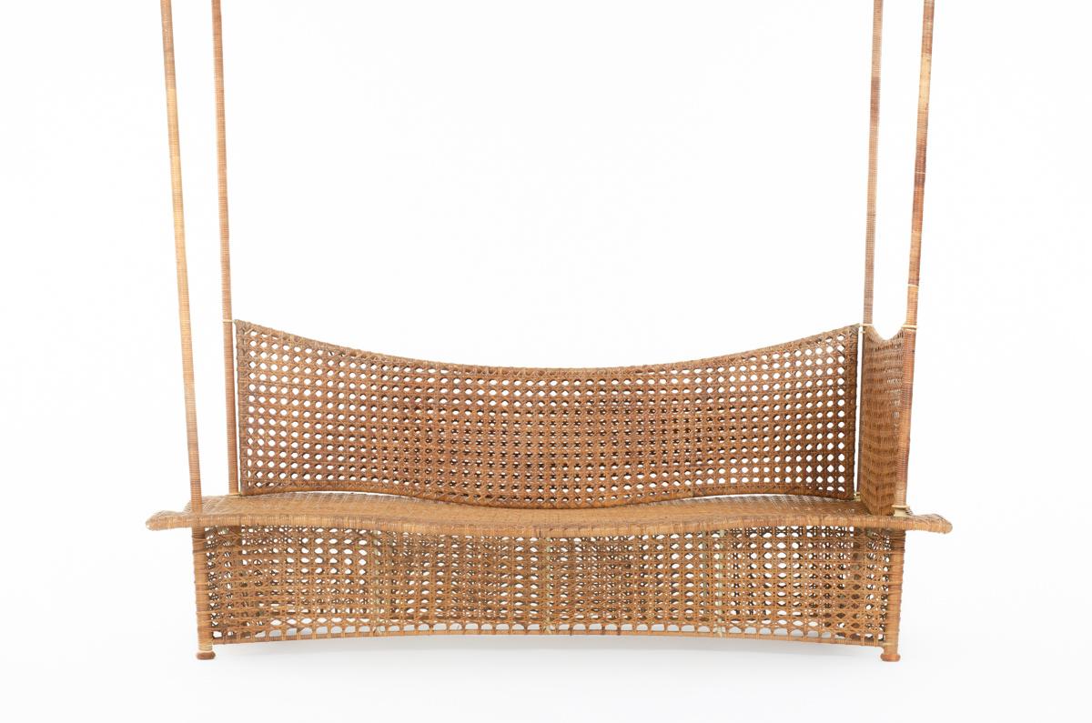 Fantastic, original and rare daybed or bench made in France in 1950. Composed of a metal structure cover entirely in cane. 4 metals arms are covered in rattan. 
Seat have a wave shape, giving a nice design. This bench is coming from an architect