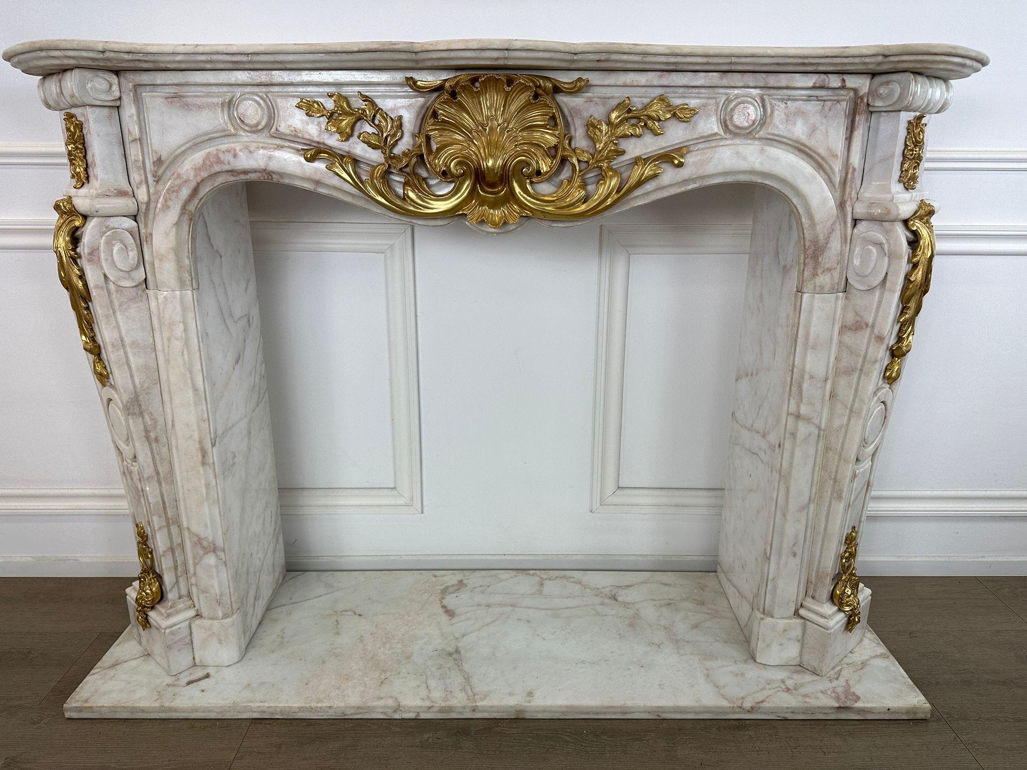 20th Century Fantastic, French marble rococo fireplace with bronze ormolu  For Sale