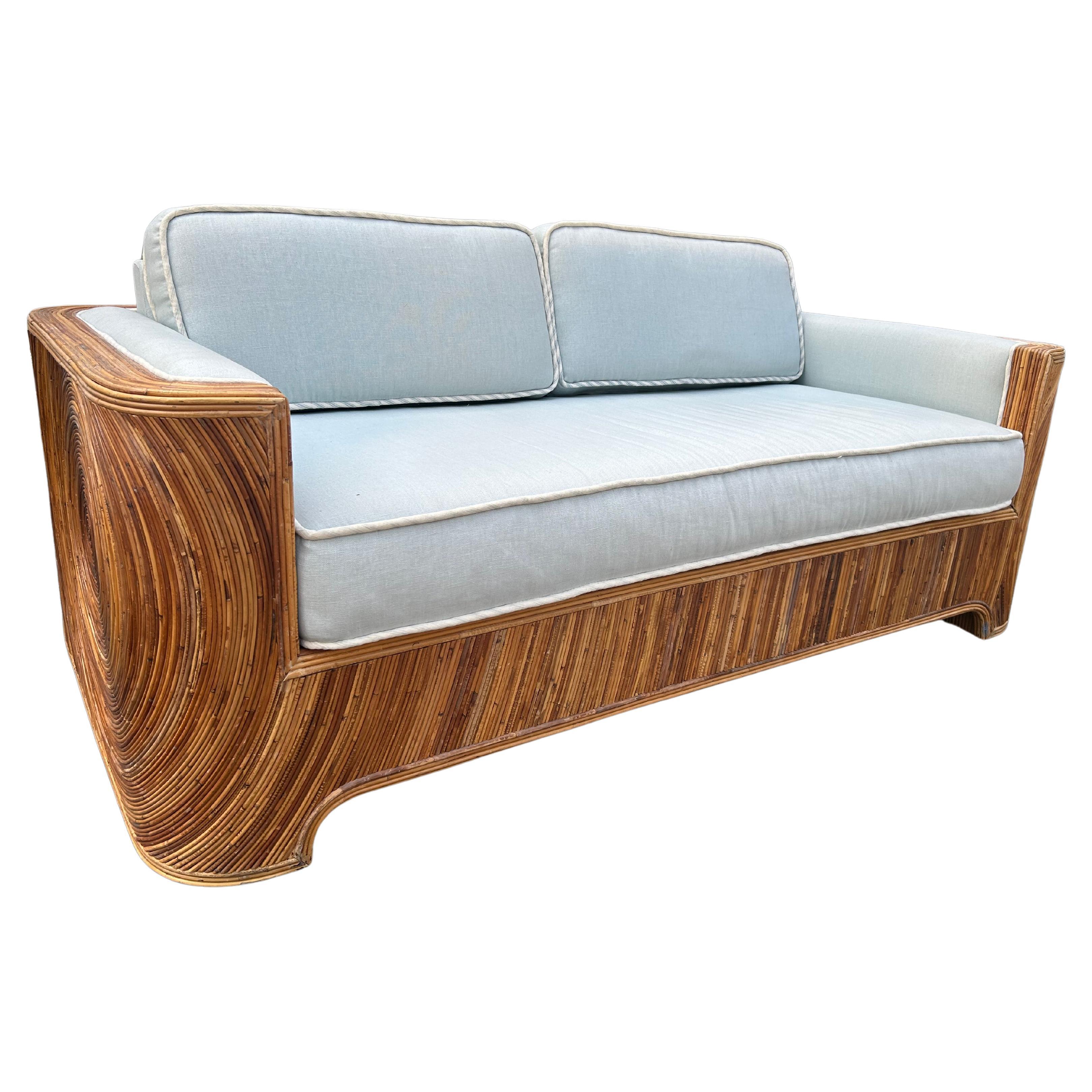 Fantastic Adrian Pearsall for Comfort Designs bent pencil reed loveseat sofa.   This piece is spectacular in person and the light blue linen upholstery is still in nice condition too-some minor sun fading.  This piece measures  27.25