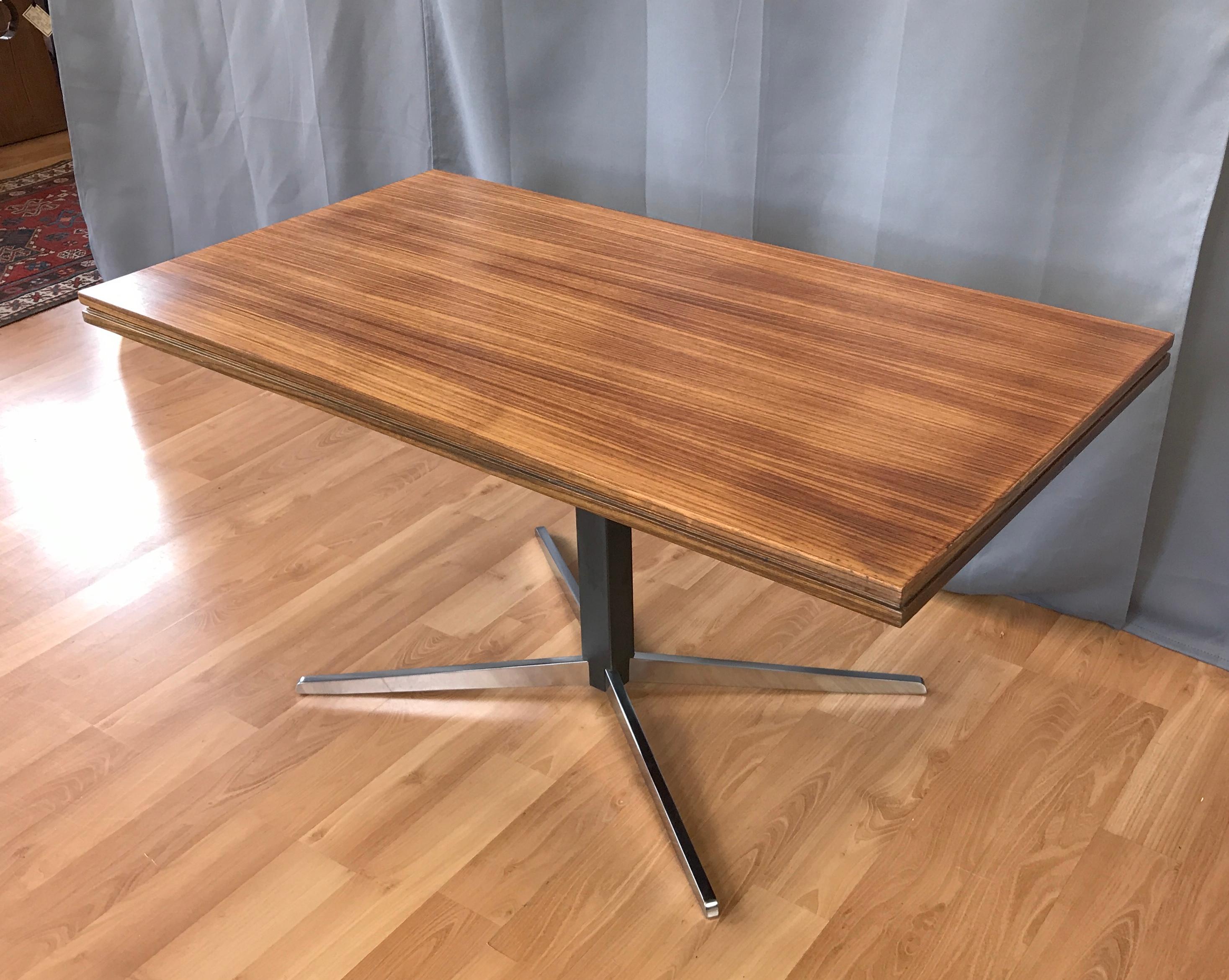 Offered here is a fantastic circa 1960s German made Rosewood table by Wilhelm Renz. 

This table goes from a coffee table height very easily to a dining table. 
Start off with coffee height, then with a little lift of the lever up it goes, pivot