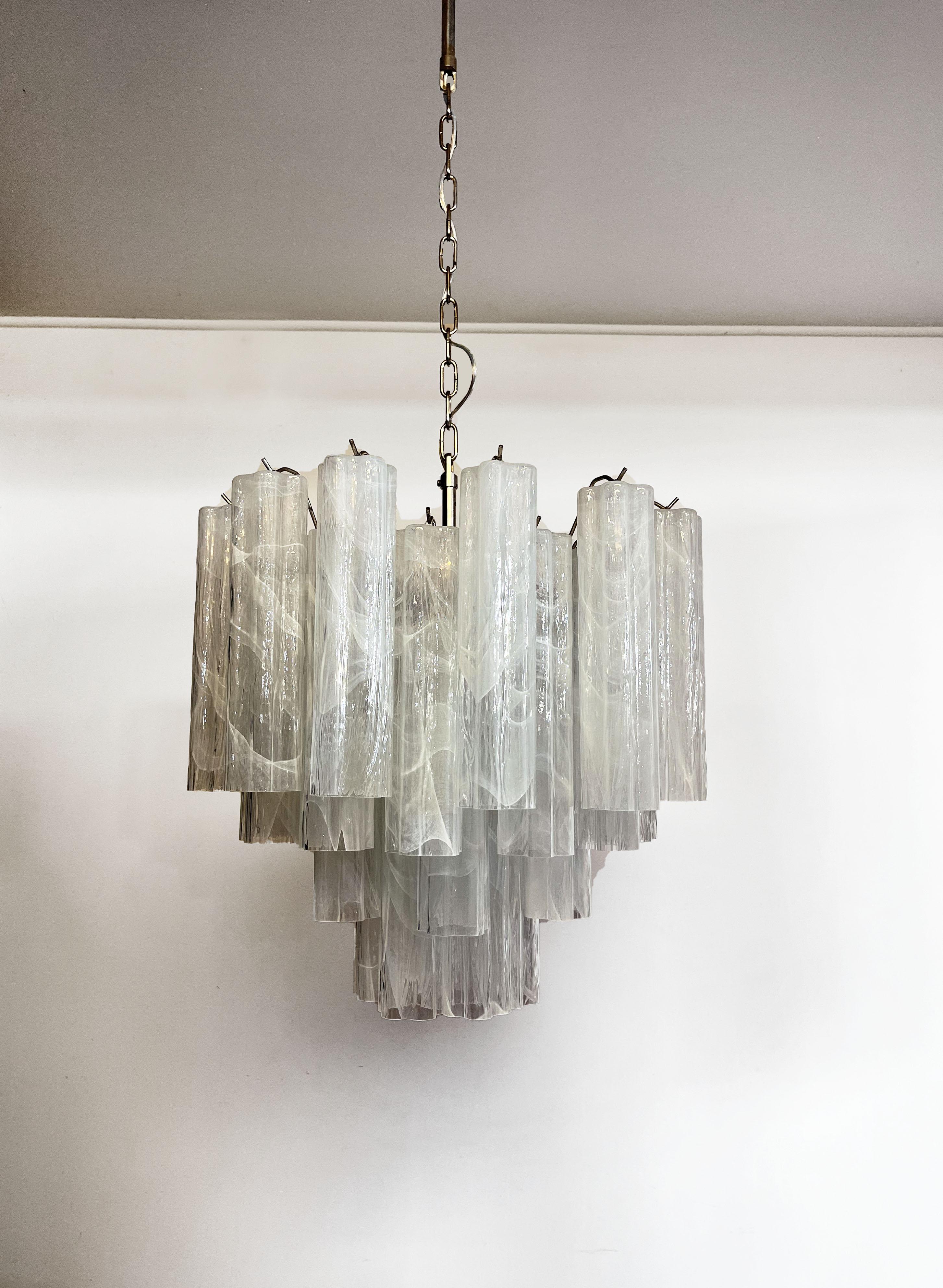 Italian vintage glass chandelier with alabaster white glass tubes. The armor polished nickel supports 36 large glass tubes in a star shape. The alabaster technique created in Venetian glassworks gives the glass an elegant grain.
Period: 	late XX