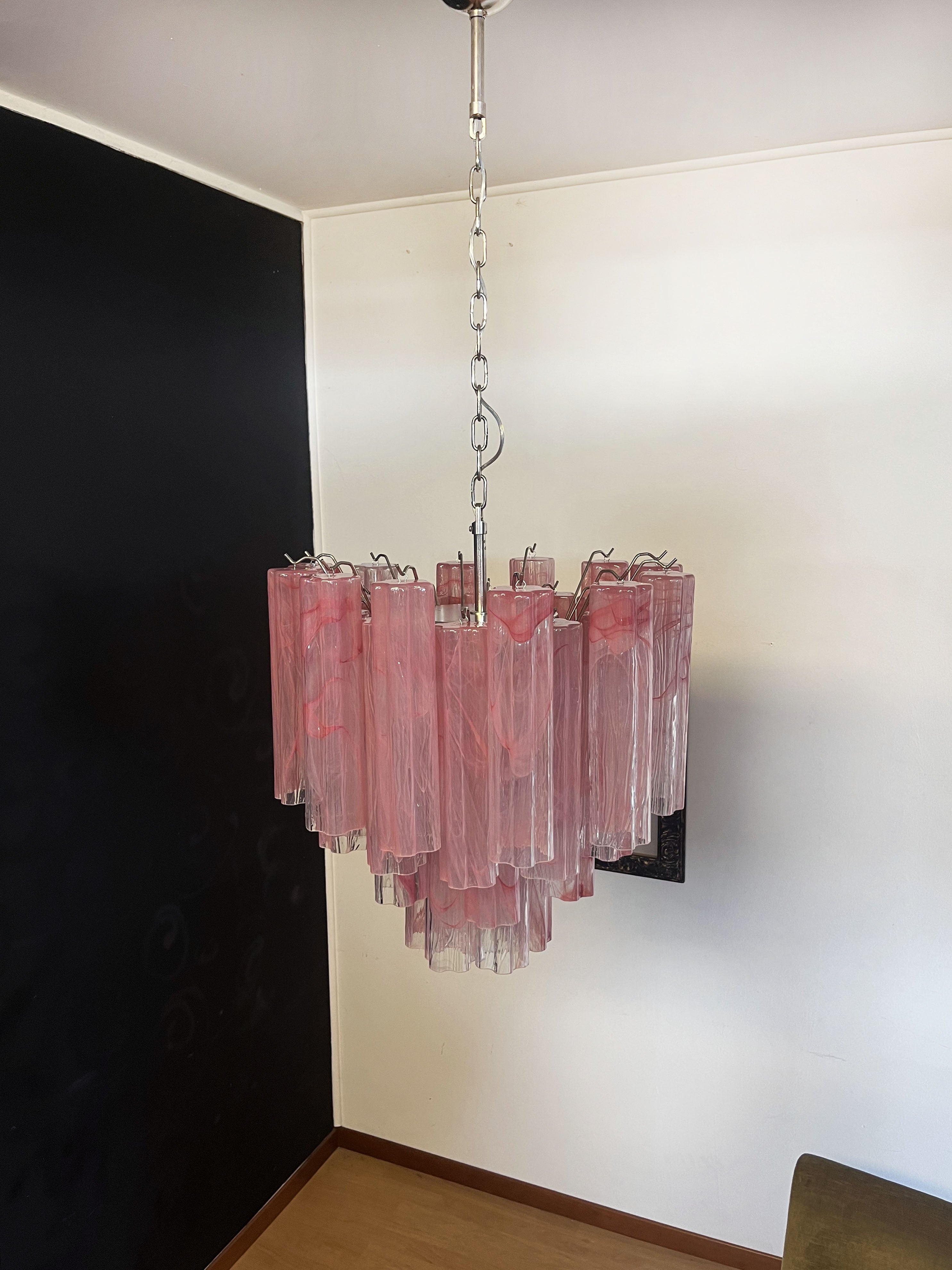 Italian vintage glass chandelier with alabaster pink glass tubes. The armor polished nickel supports 36 large glass tubes in a star shape. The alabaster technique created in Venetian glassworks gives the glass an elegant grain.
Period: late XX