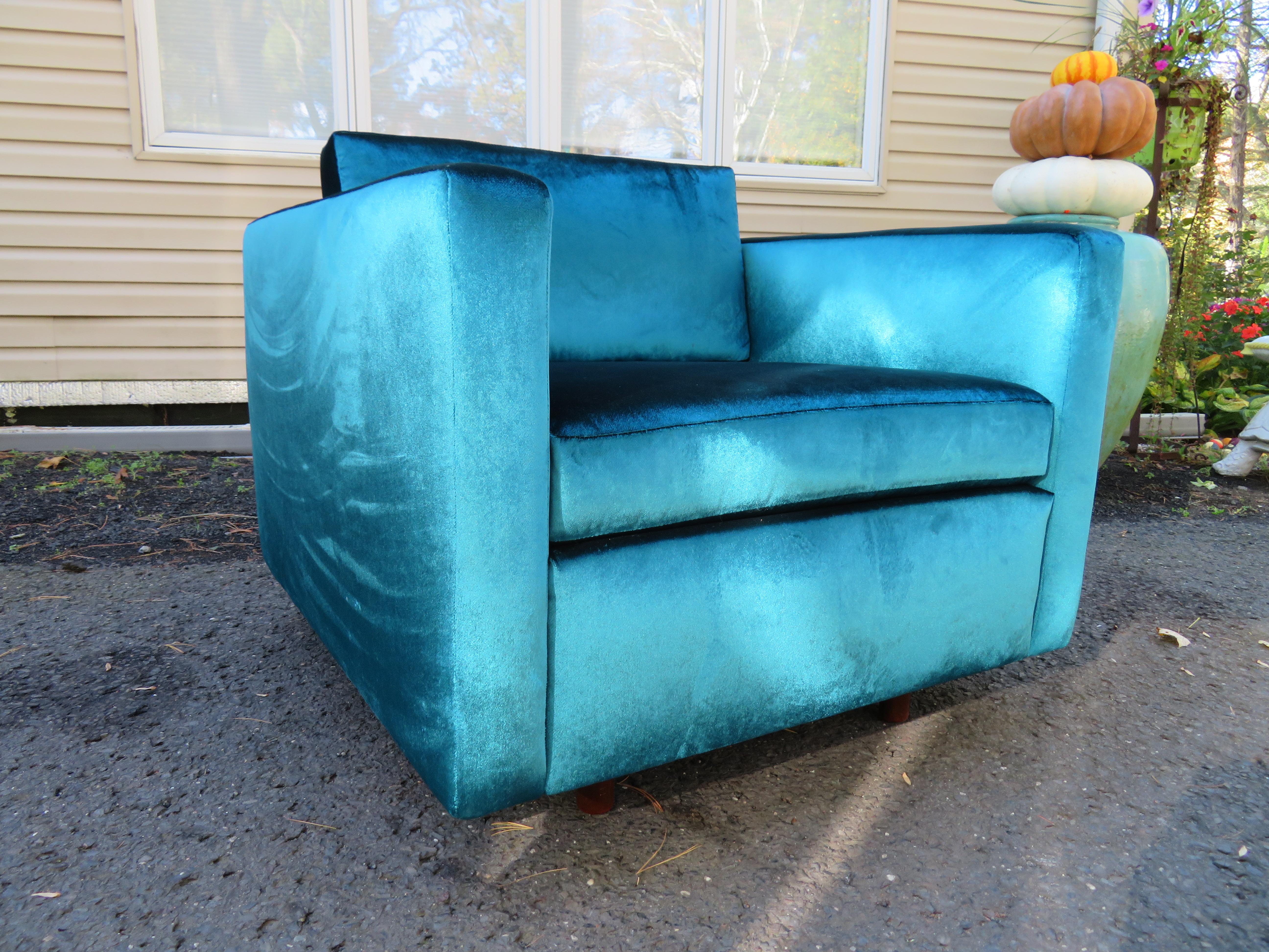 Luscious Harvey Probber style even arm tuxedo lounge chair. This chair has been reupholstered with high-end peacock blue velvet and has all new foam and springs. It is truly stunning in person and is also very comfortable-ready to slip right into