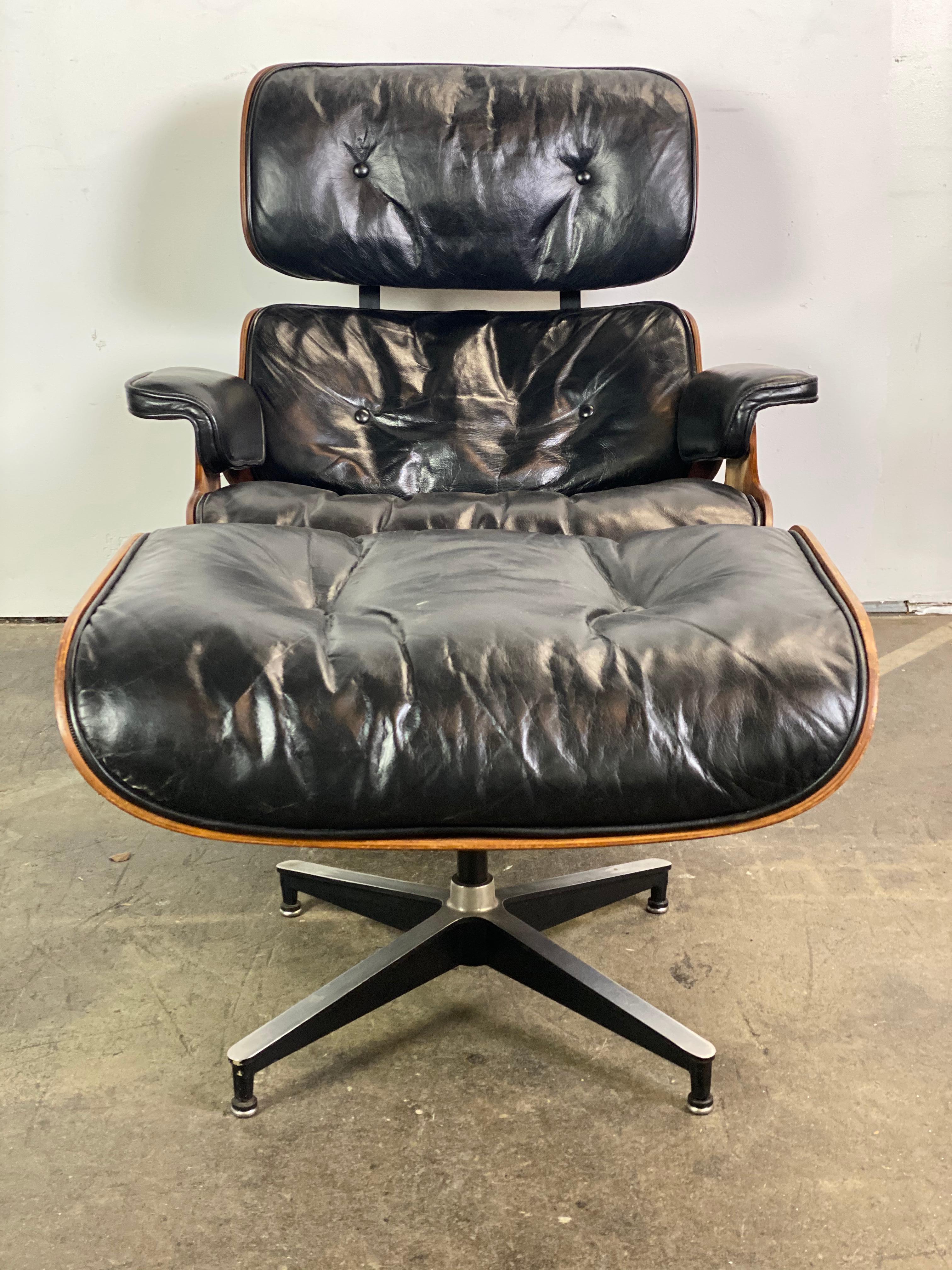 Gorgeous Classic Eames lounge chair and ottoman. Executed in. Brazilian rosewood and original black leather. Replaced seat shock mounts ($750 value). Signed and guaranteed authentic. Leather cleaned and tuned up, wood refinished. All foot glides