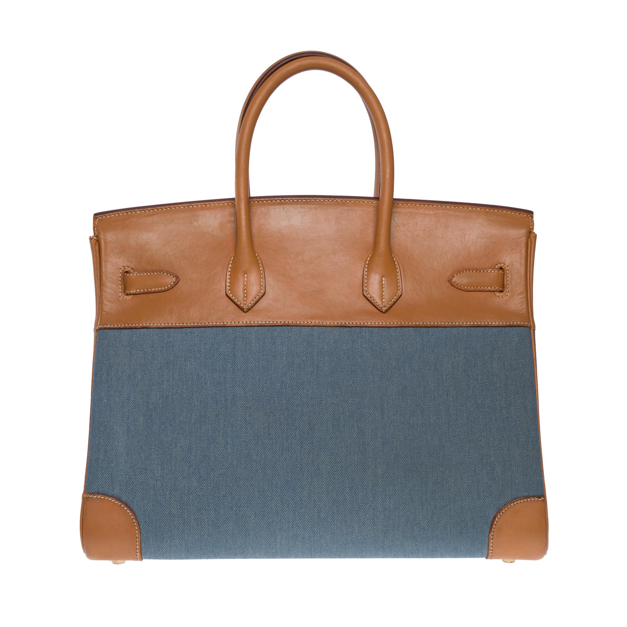 Stunning and Rare Hermès Birkin 35 bi-material in fauve barenia leather and blue denim canvas, gold plated metal hardware, double handle in fauve barenia leather allowing a hand-carry
Flap closure
Inner lining in fawn leather, one zippered pocket,