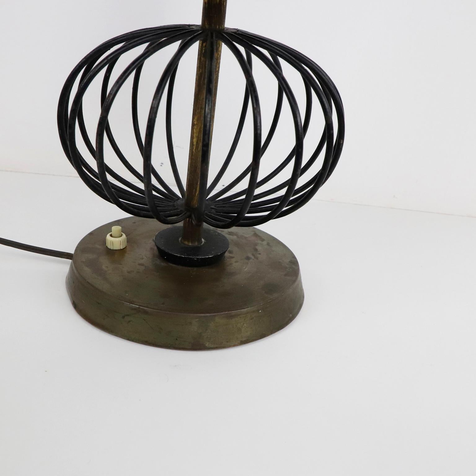 We offer this fantastic iron and brass lamp by Arturo Pani with amazing patina, circa 1950.