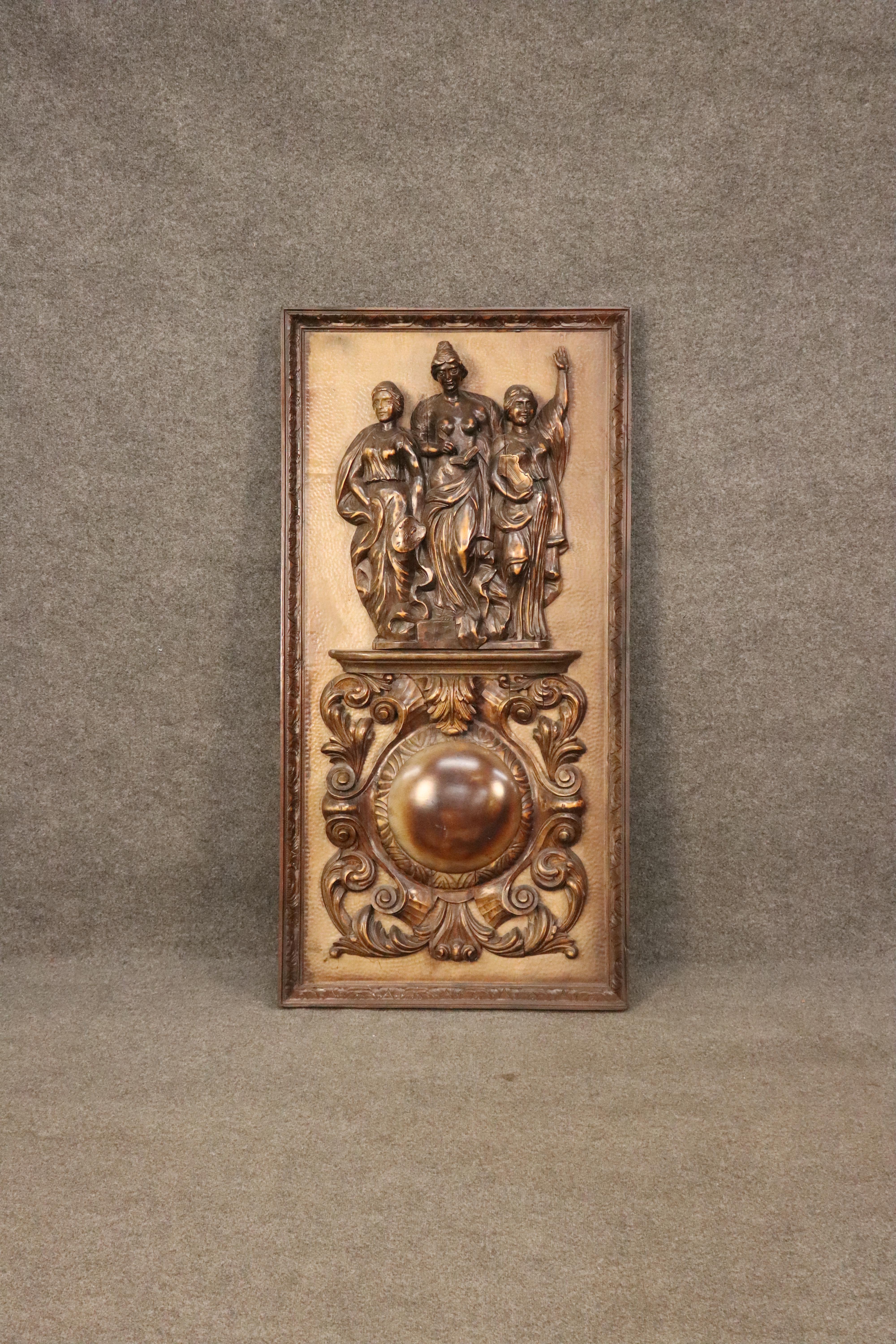 This is a truly magnificent and massive panel featuring carved figures and long forgottent meanings. The carvings have age cracks and old repairs and loads of character and charm. They are beautifully carved. The massive panel features stippled