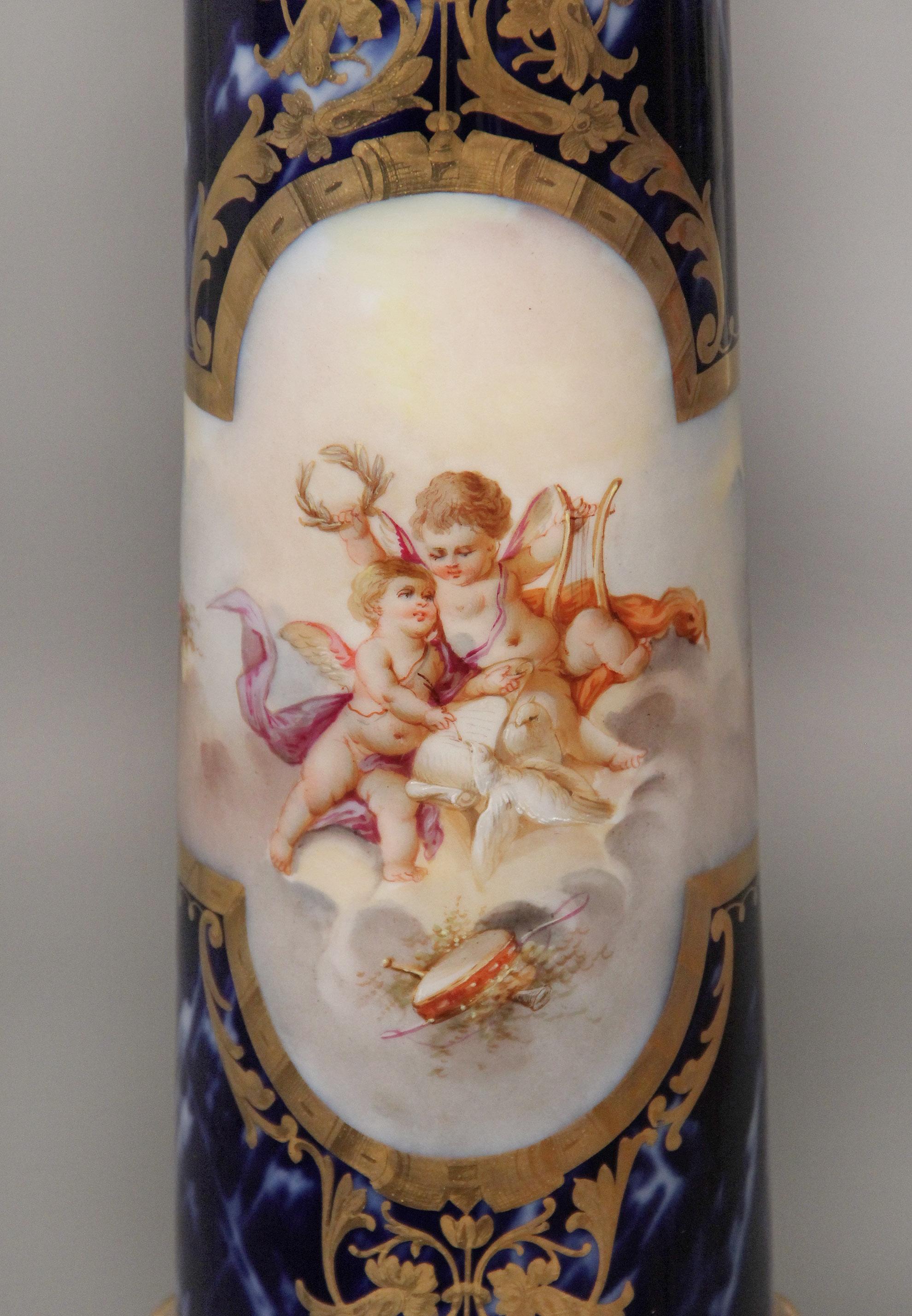 A rare and fantastic late 19th century gilt bronze mounted onyx and Sèvres style pedestal.

Square onyx top above a columnar support painted with lovely scenes of women and cherubs, the back painted with more cherubs and women, surrounded by