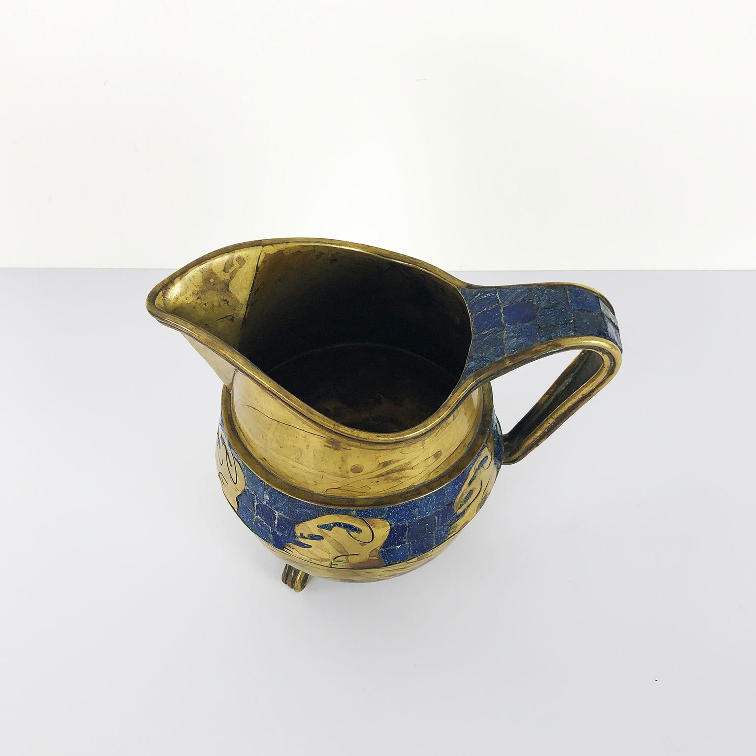 We offer this fantastic mosaic and brass pitcher designed by Salvador Teran in excellent vintage conditions, circa 1960.

About Salvador Teran: Born in Taxco, (1920-1974) trained with William Spratling at el Rancho 