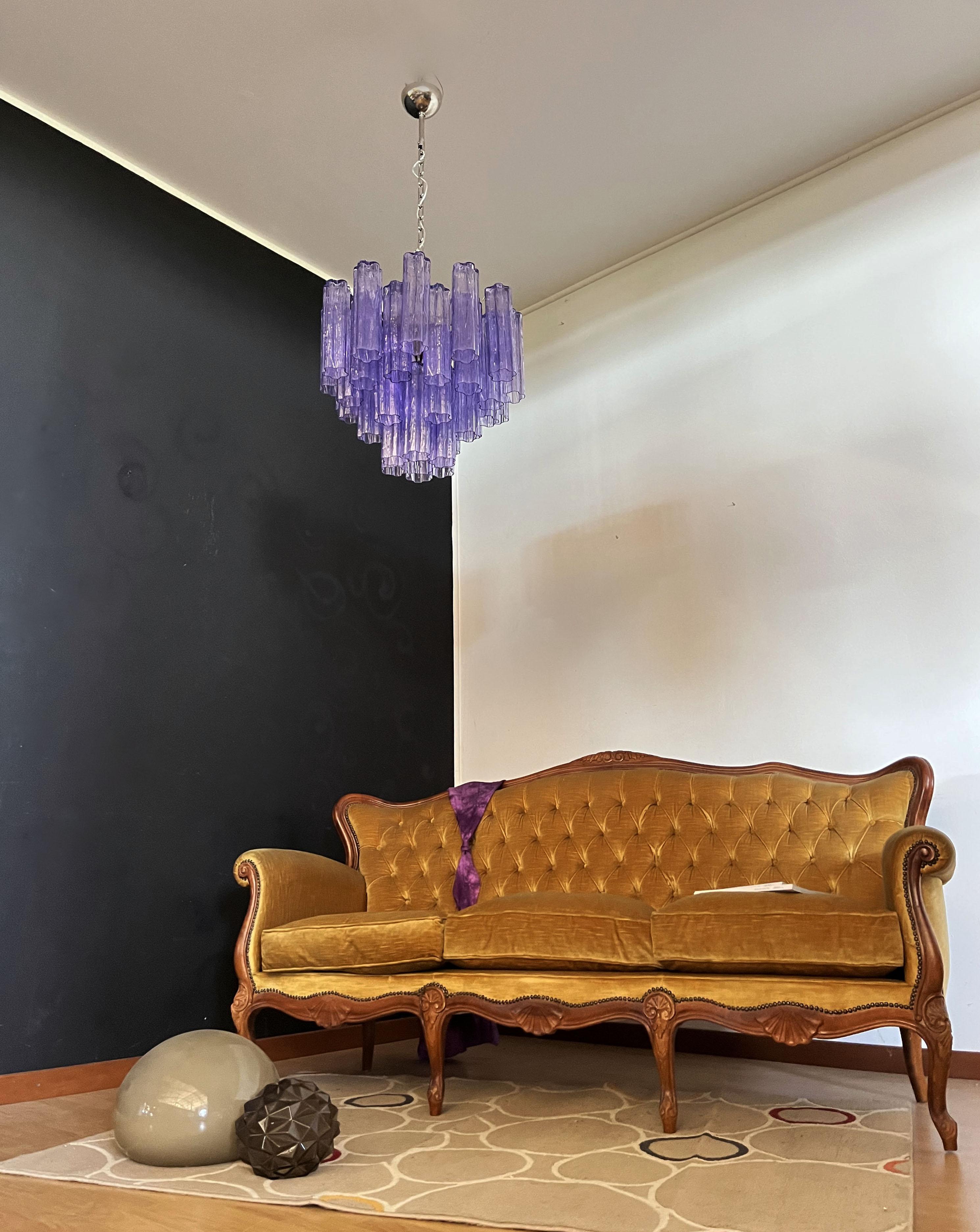Italian vintage chandelier in Murano glass and nickel-plated metal structure. The armor polished nickel supports 36 large amethyst glass tubes in a star shape.
Period: late XX century
Dimensions: 45,30 inches (115 cm) height with chain; 19,70