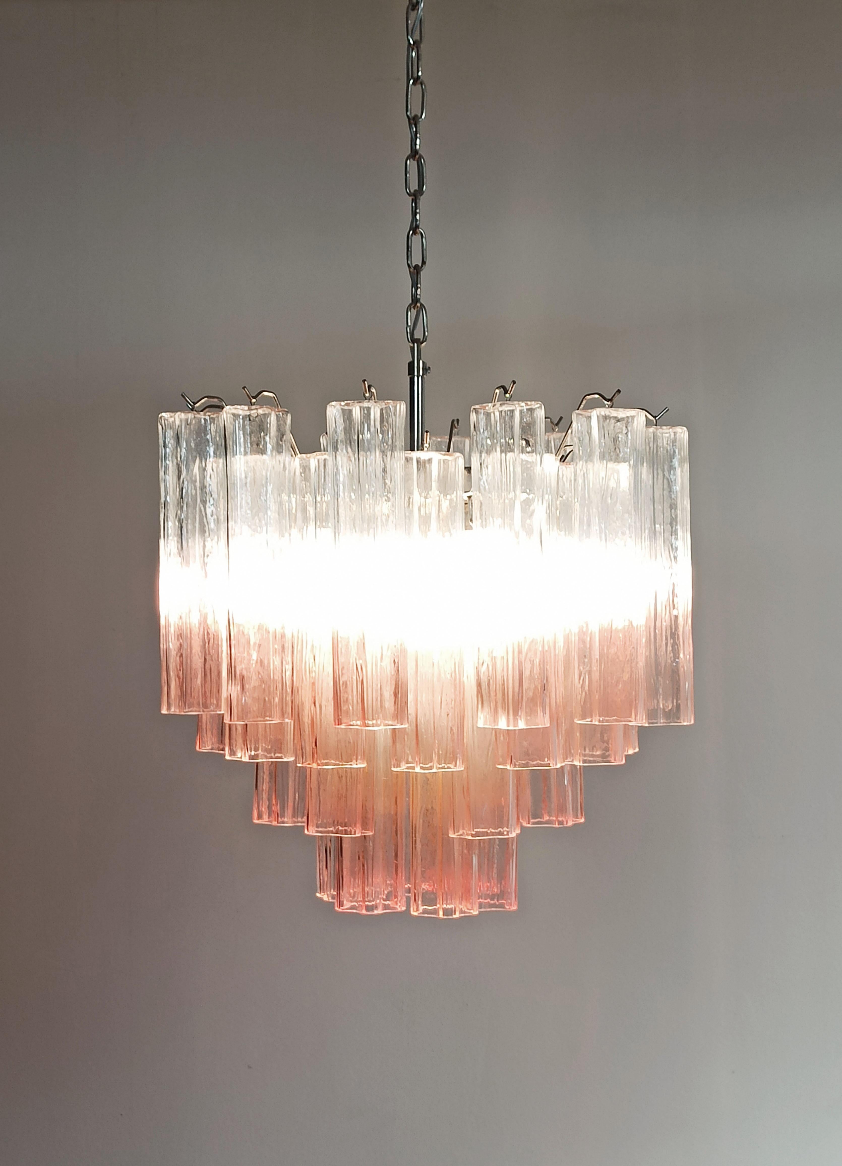 Italian vintage chandelier in Murano glass and nickel-plated metal structure. The armor polished nickel supports 36 large shaded pink glass tubes in a star shape.
Period: late 20th century
Dimensions:  49 inches (125 cm) height with chain; 23.30