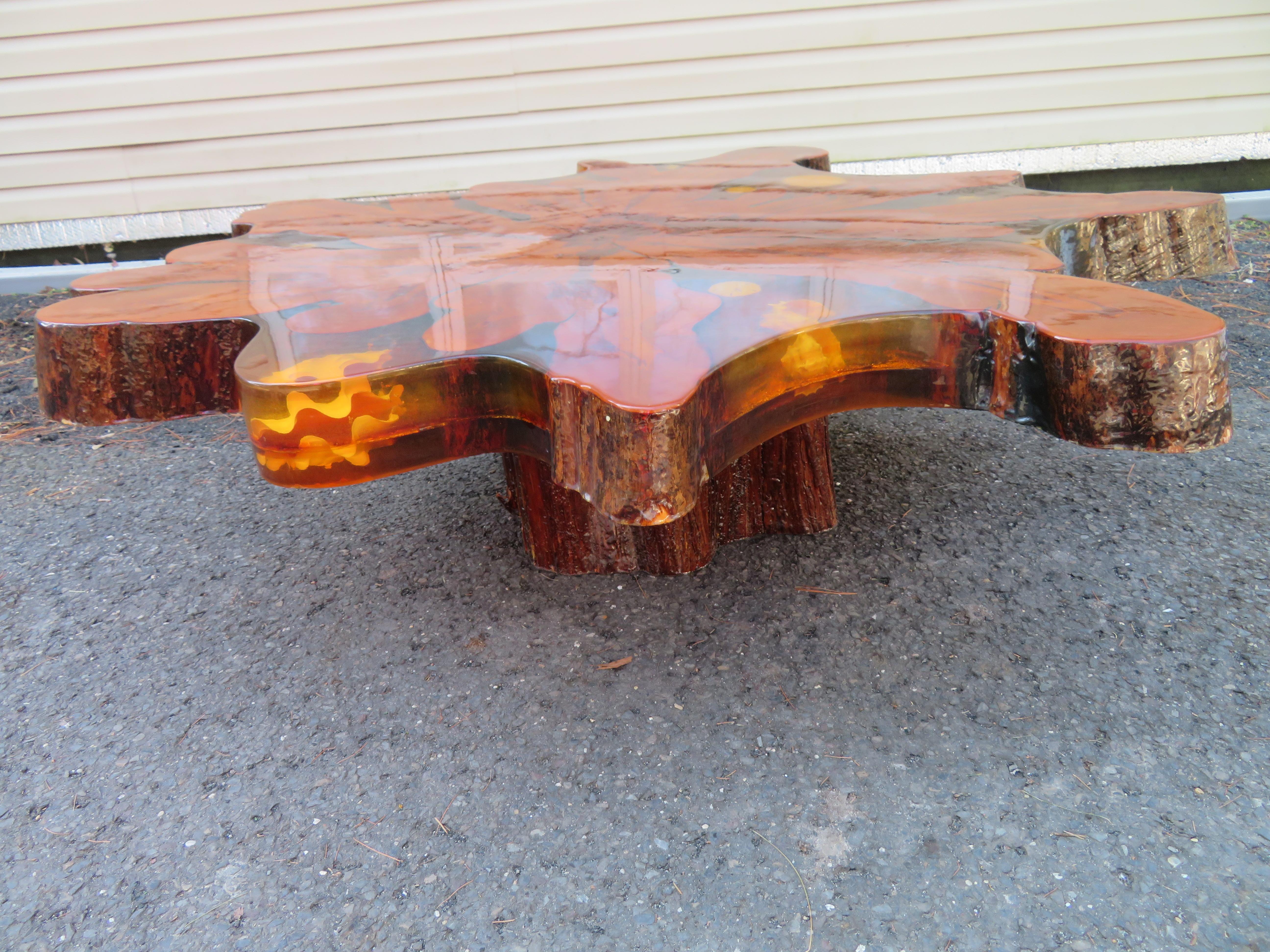 Magical live edge cypress slab coffee table with embedded seashells. This table is drop-dead gorgeous and would be perfect in a beach house setting. There are wonderful seashells embedded within a 5
