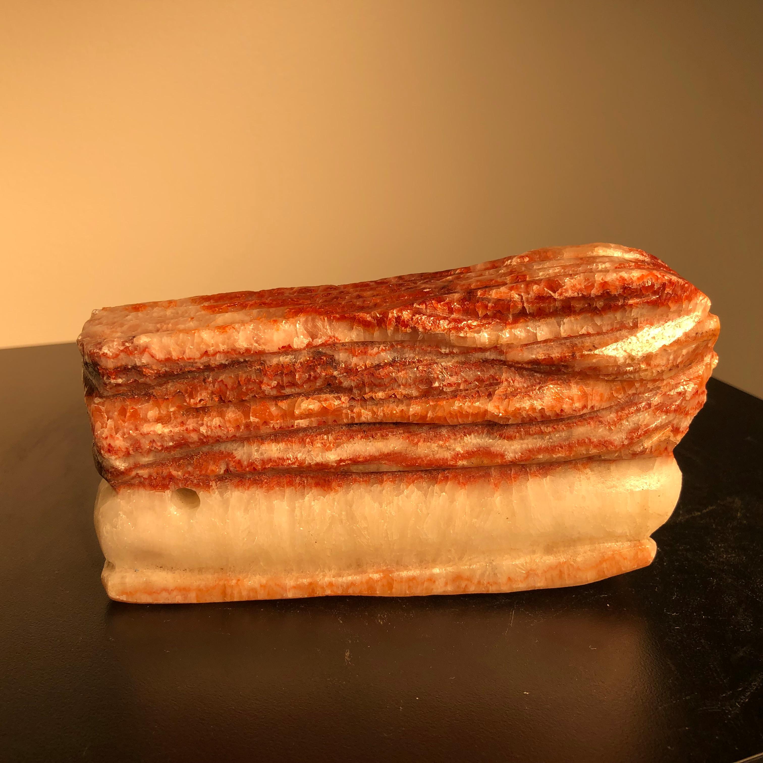 Here is an authentic example of a Chinese food stone (Shiwu) which imitates a real slice of meat.

Each piece is actually a found stone that resembles a thick cut of beef or pork. 

A fantastic natural stone, meat or food these stones are widely