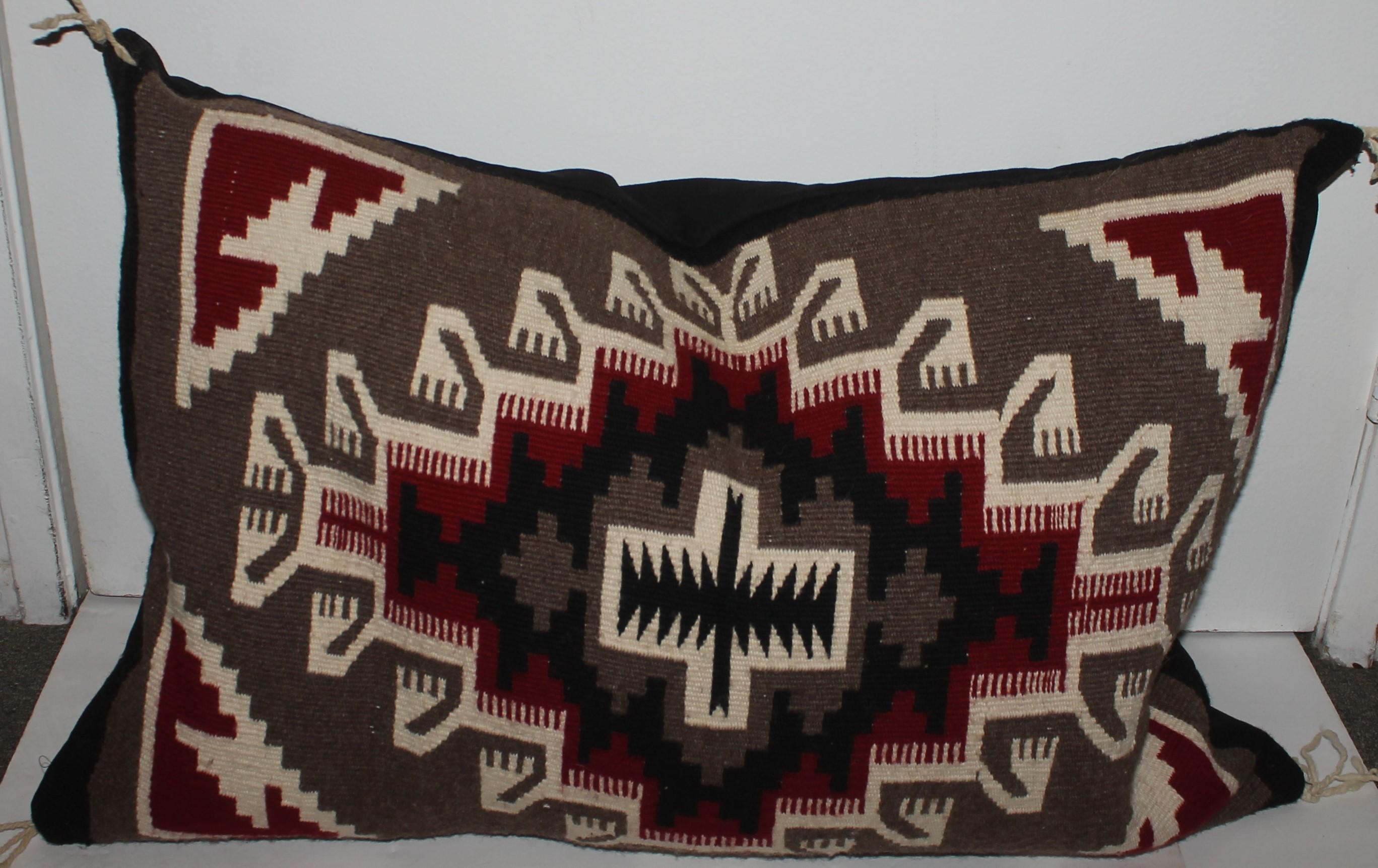 This fine two grey hills Navajo Indian weaving pillow is in good condition and has a black cotton linen backing.