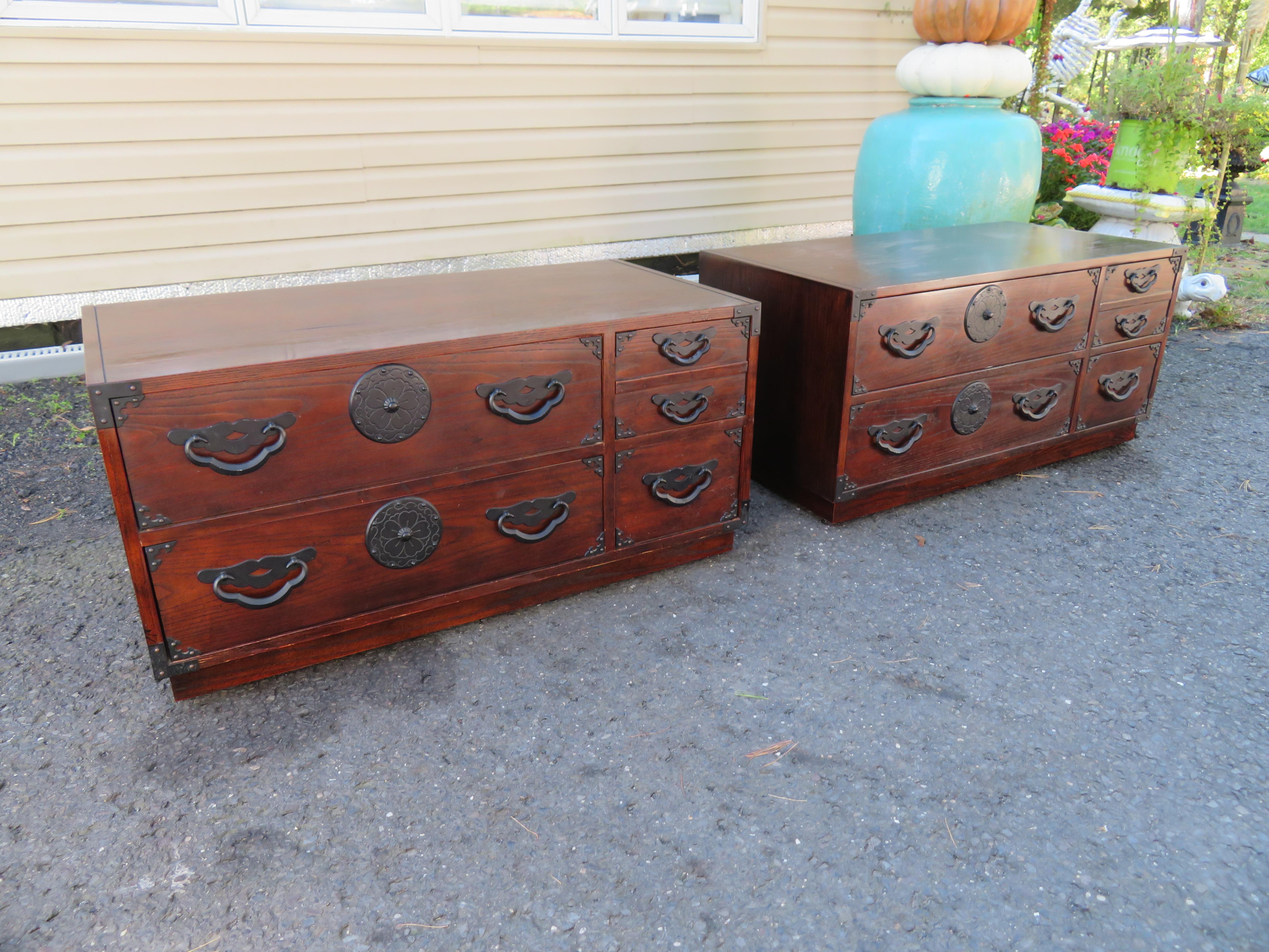 Pair of amazingly beautiful Japanese Tansu small chests or nightstands by Baker. Dark stained oak with fantastic Japanese inspired hardware. They have a time-worn patina with splendid charm. I love the vintage look of these- gives your interior real