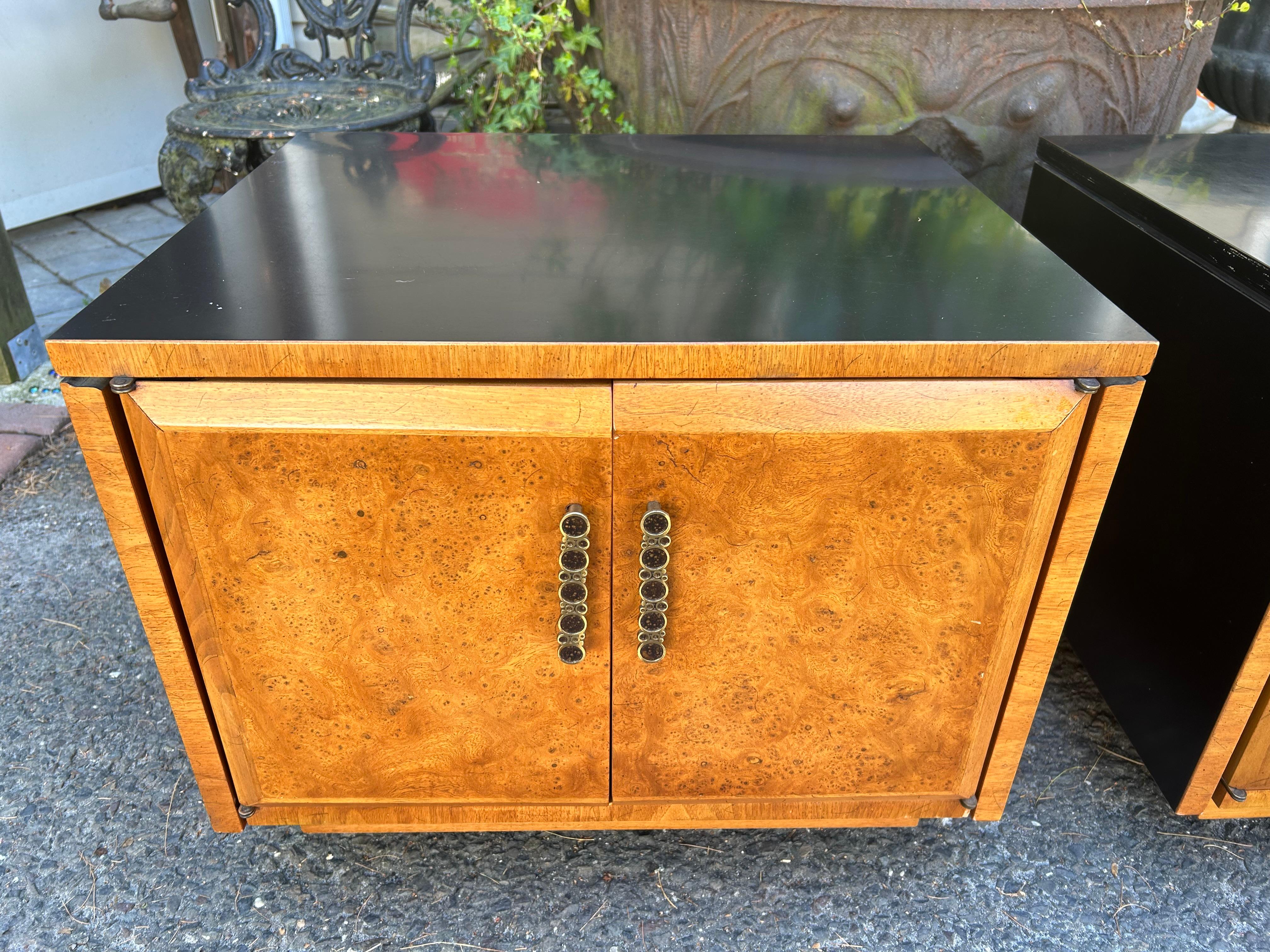 Unusual pair of burl wood rolling end tables by Heritage with flip up ends.  Wow, these small rolling tables do it all with tons of storage and both ends flip up to increase the table tops.  We love the burled wood on the door fronts and back