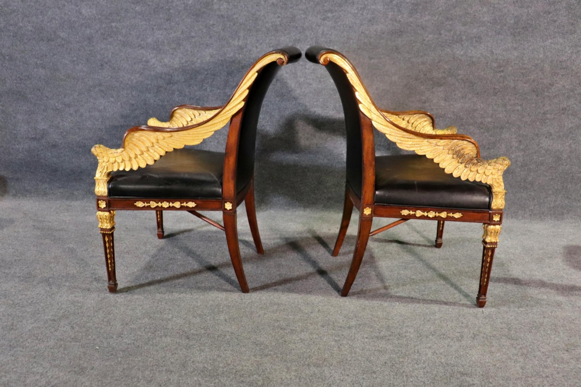 Jonathan Charles Empire-style Arm chairs. Gold gilt Angel wing arms. Leather seats & backs with Walnut frames. Wear to black leather that can be re-dyed by ourselves if asked to do so. 


Dimensions: 37 3/8