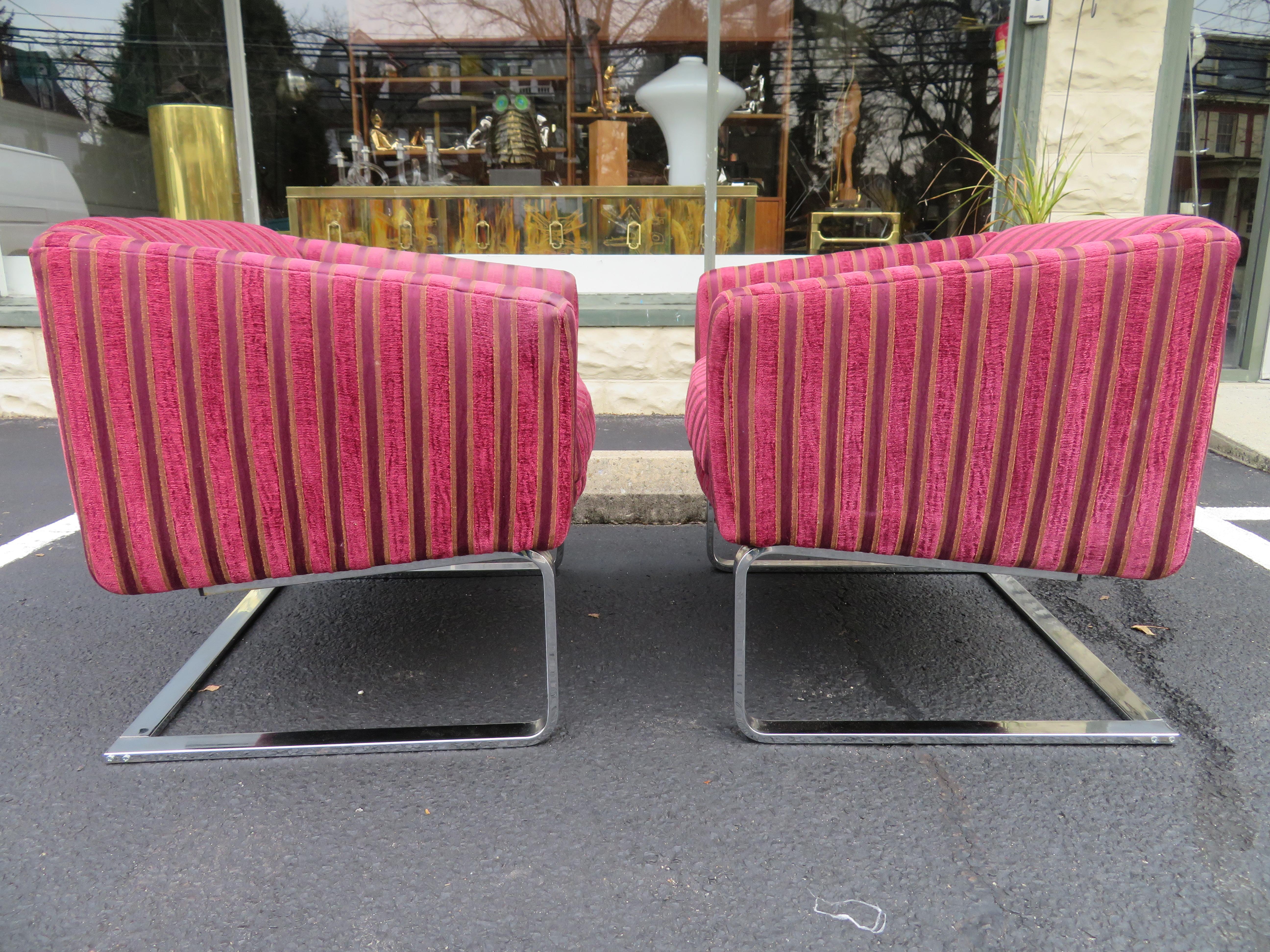 Fantastic pair of Milo Baughman style chrome cantilevered lounge chair by Selig. These fine chairs were re-upholstered in the 1980s and will need to be redone but the heavy chrome frames look smashing! Just the right amount of vintage patina to give