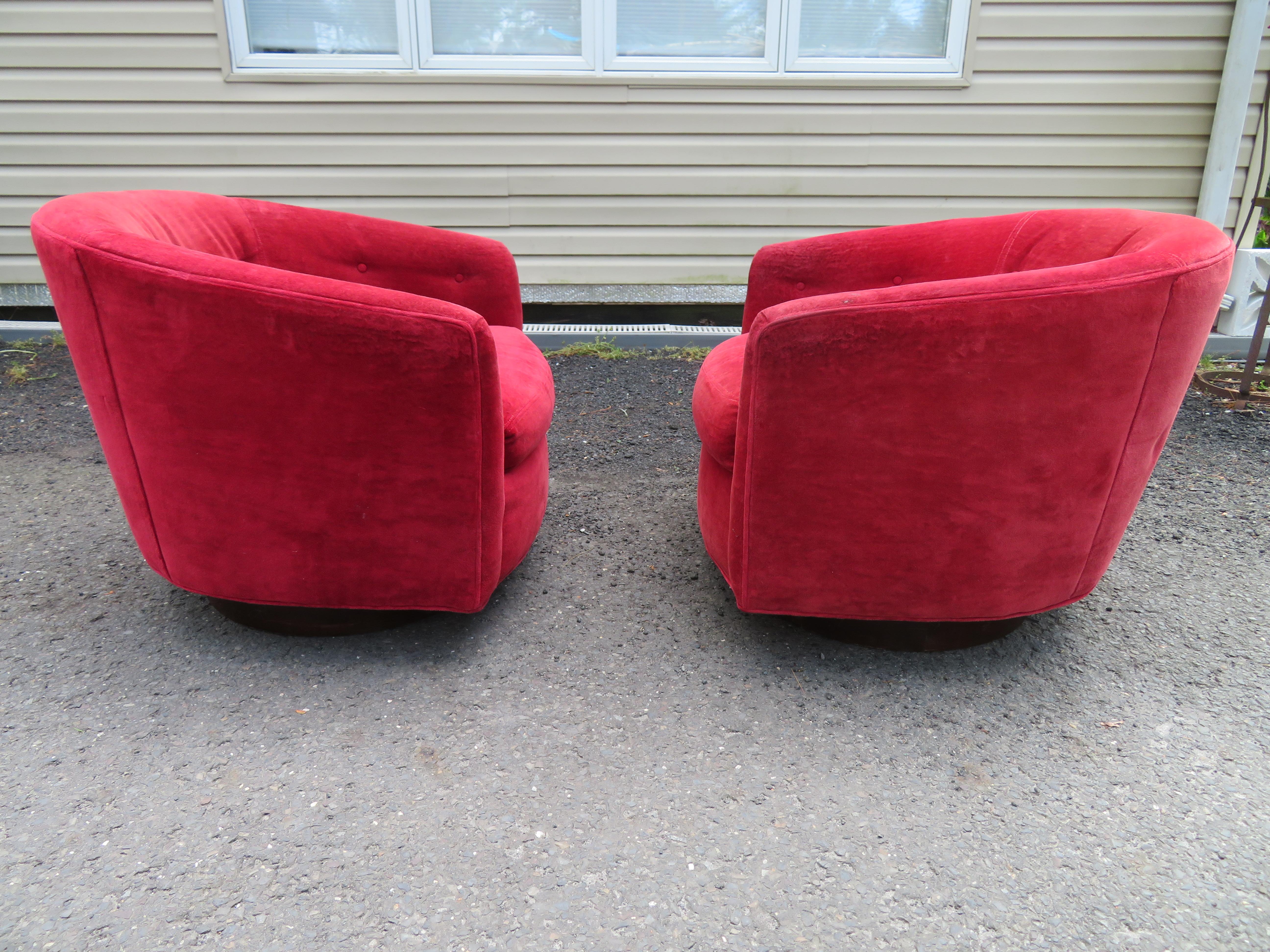 Fantastic pair of Milo Baughman style swivel rocker barrel back lounge chairs made by Selig. We love these swivel rockers, they are super comfortable to sit in. They measure 26.5