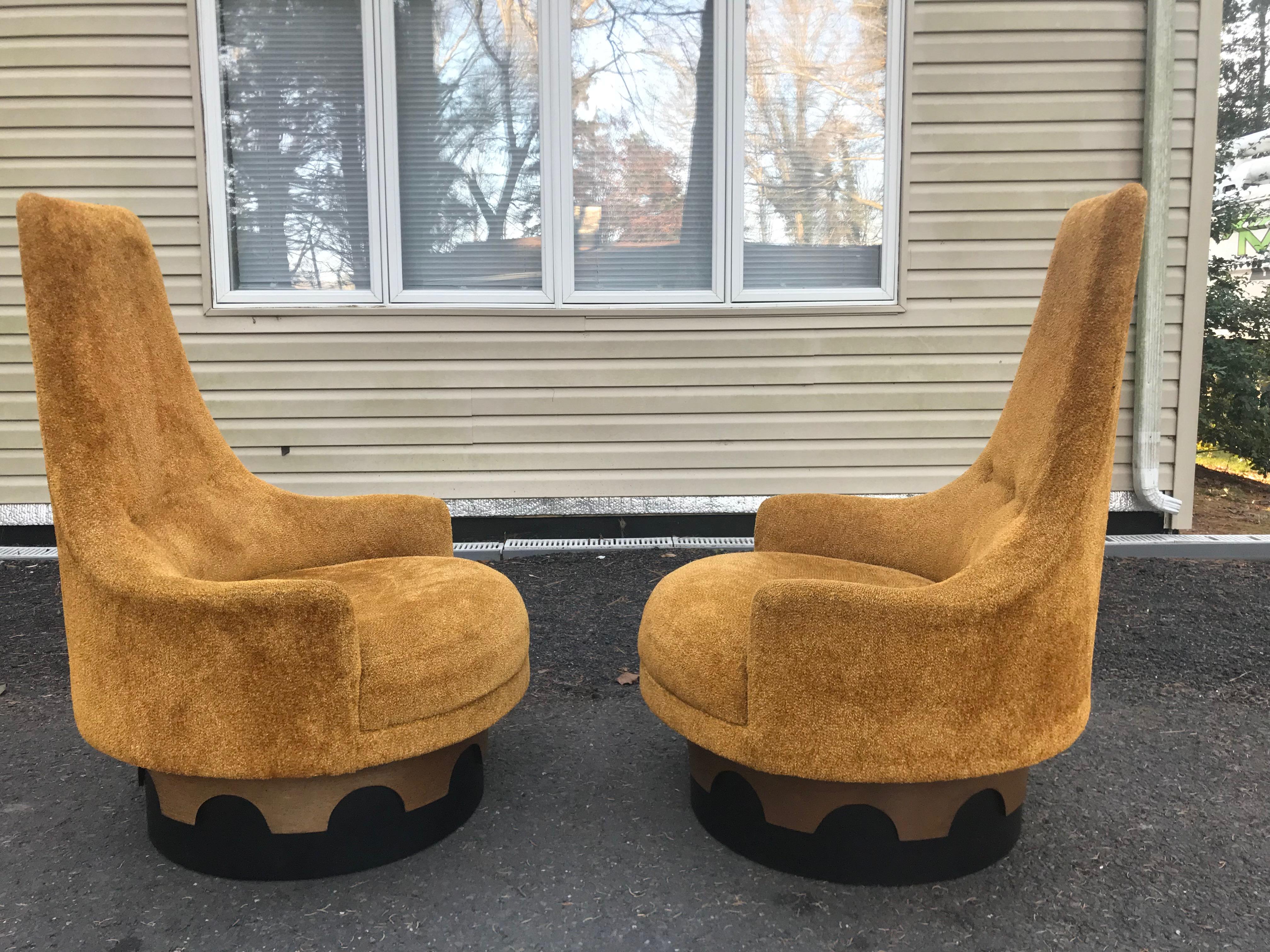 Fantastic pair of Adrian Pearsall tall back swivel lounge chairs. The upholstery is original and is dated but is still usable as is-reupholstery is recommended to look their best.