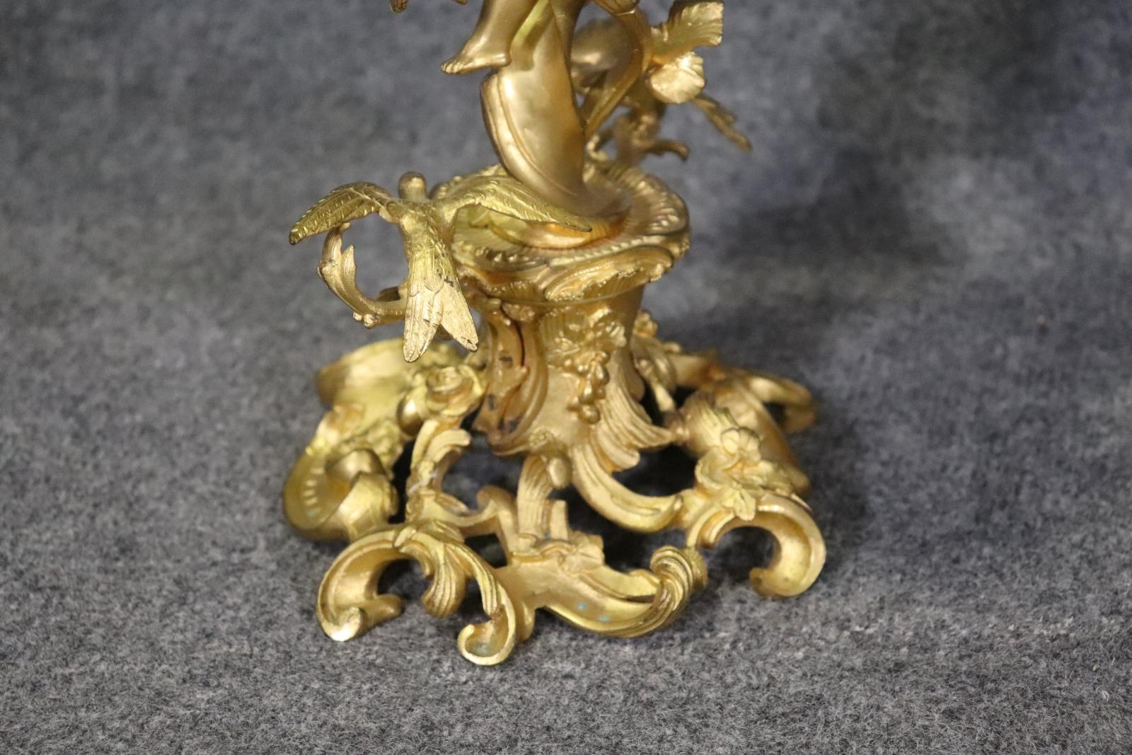 Absolutely breathtaking cherub or putti done in a fantastic naturalistic style with dore' gold overlay. Gilt bronze. Figural. 25 3/4