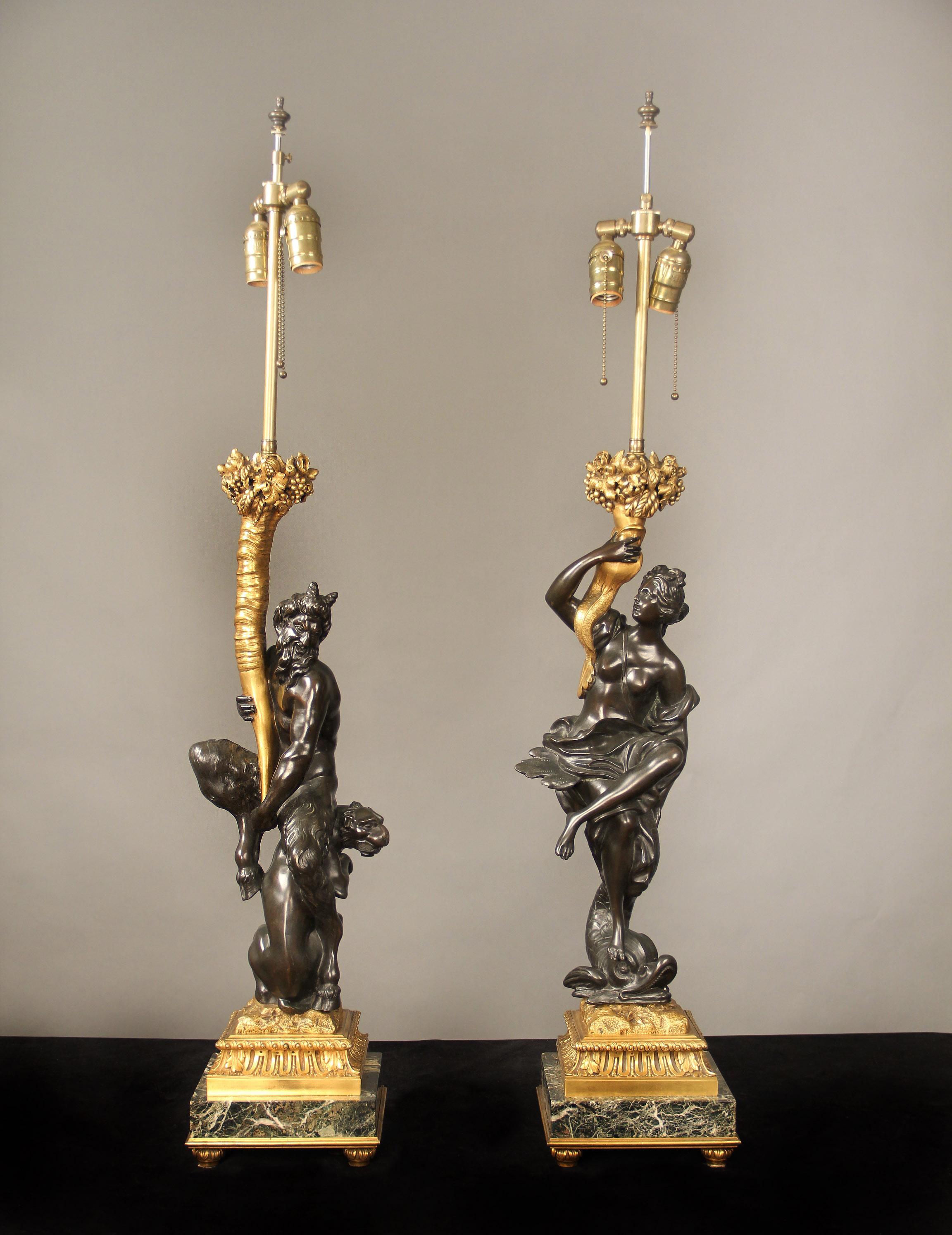 A fantastic pair of early 20th century gilt and patinated bronze and marble figural candelabra By Caldwell

Edward F. Caldwell and Co. Inc. New York

These famous candelabra modeled as two figures, one as a bacchante, seated on a dolphin, and