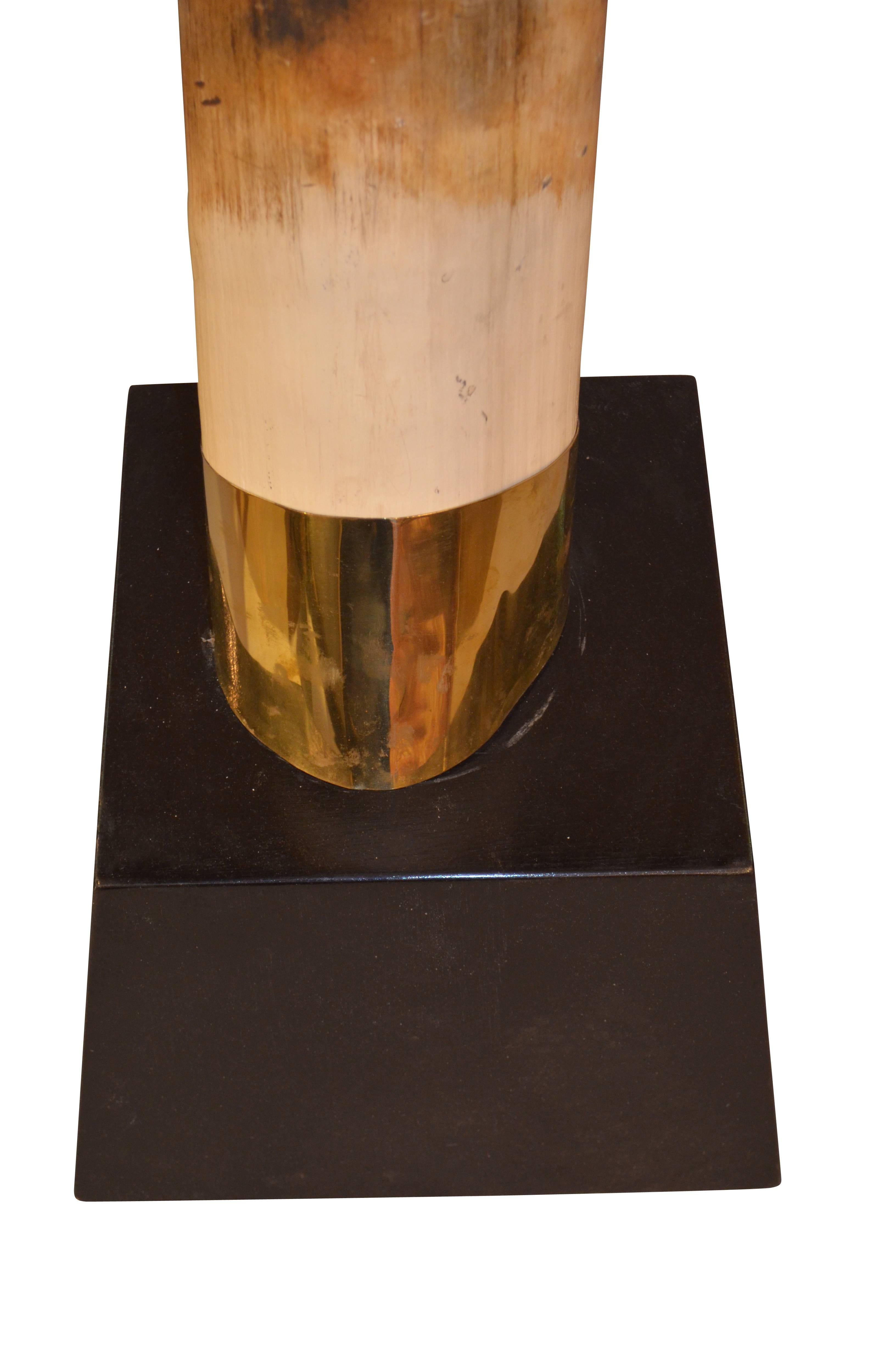 Pair of Faux Resin Elephant Tusks on Ebonized Bases In Good Condition For Sale In London, GB