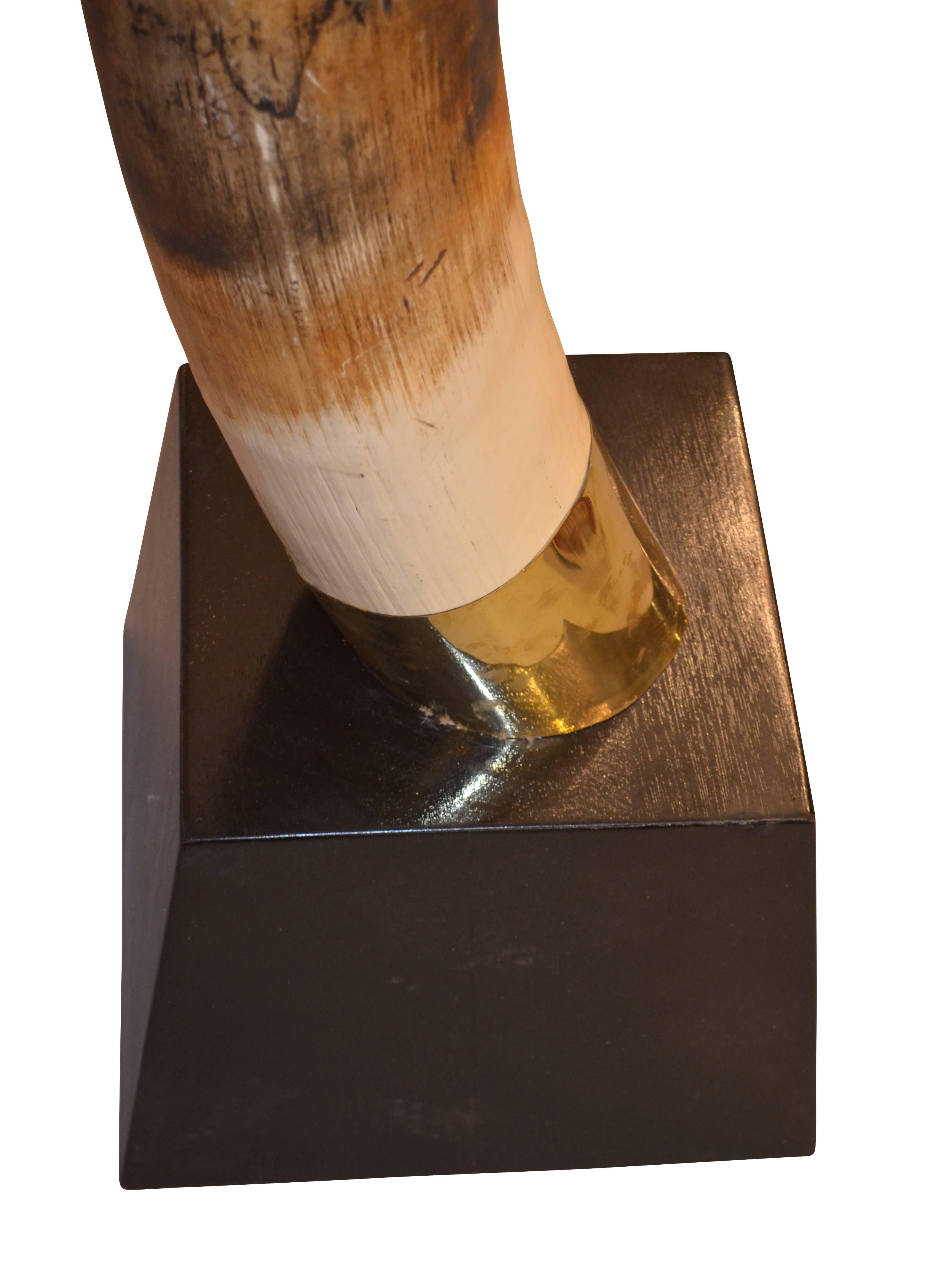 Contemporary Pair of Faux Resin Elephant Tusks on Ebonized Bases For Sale