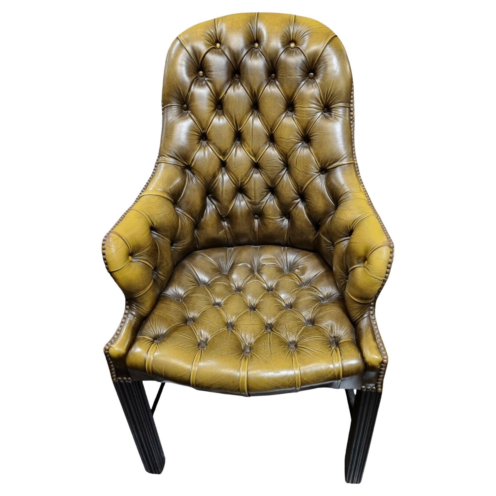 A Lovely Olive Green Buttoned Back Library Chair
Standing on a Ebonized Hardwood Base
Made by Wade of Long Eaton
C1960s