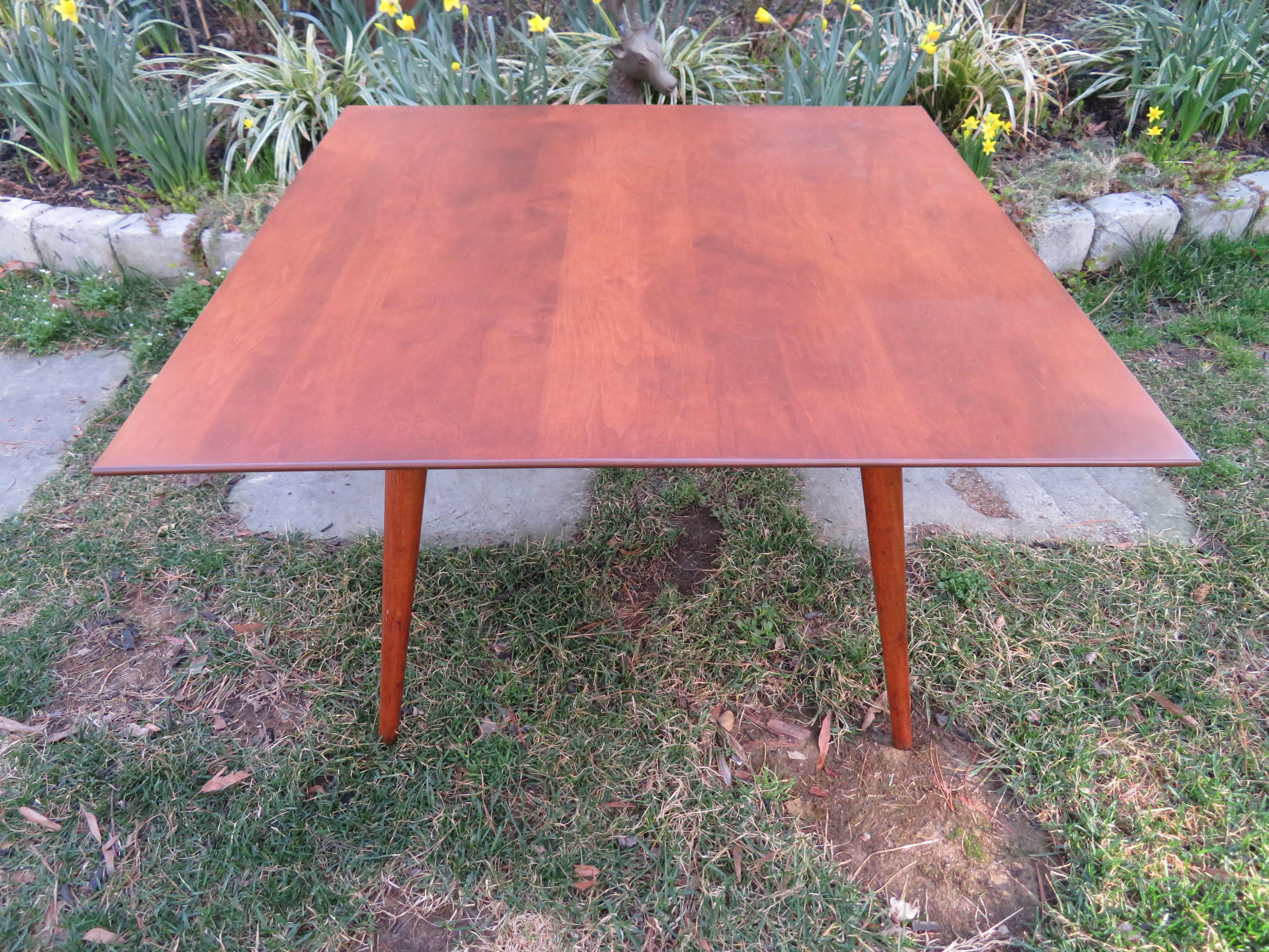 Fantastic Paul McCobb for Planner Group mid century square coffee table. This piece is in very nice condition with the top being newly refinished. Coffee table measures: 32 wide x 32 deep x 20.25 high.