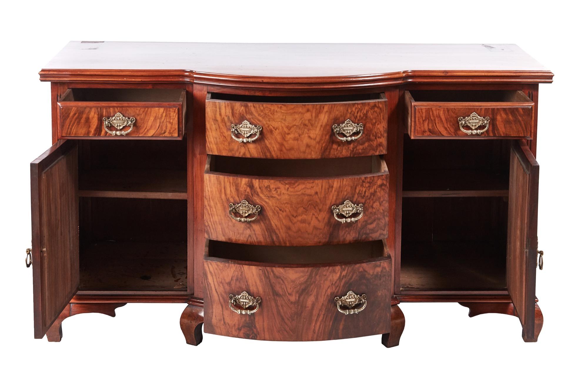 Fantastic quality antique Victorian carved walnut sideboard with a beautiful shaped walnut top, five lovely walnut drawers with original brass handles, two carved solid walnut doors original brass handles opening to reveal a fitted shelf interior.