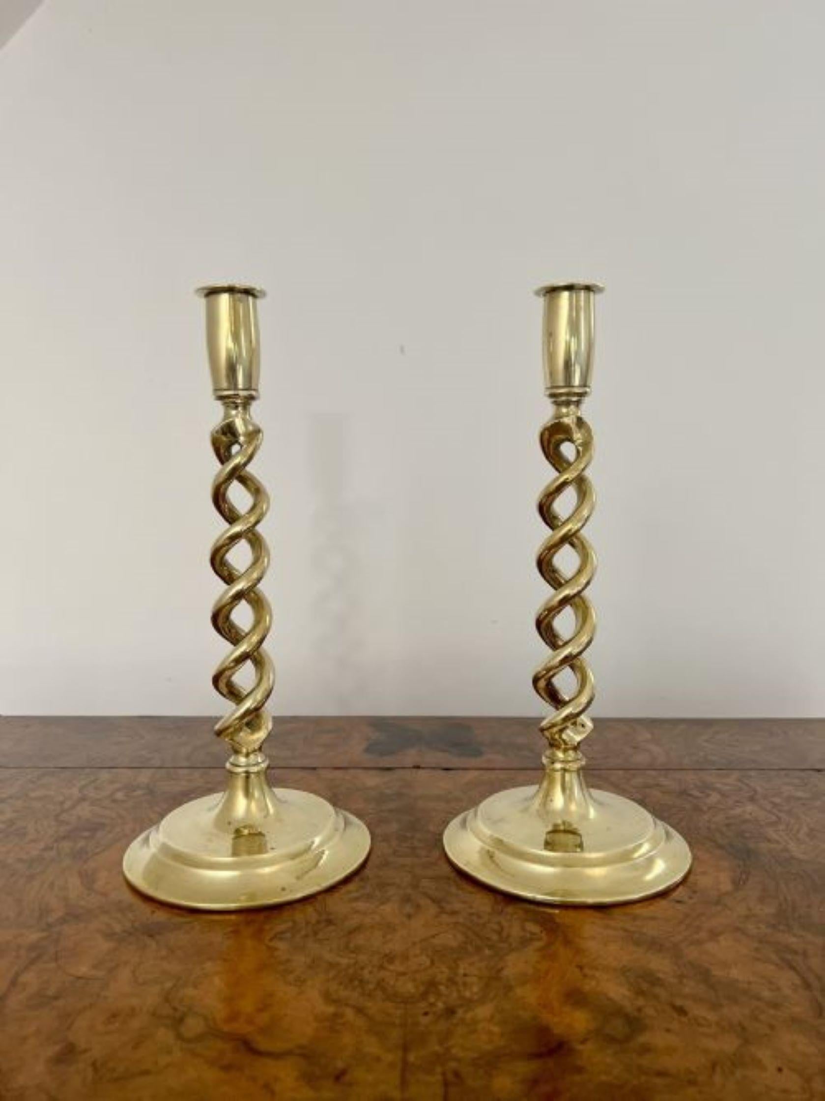 Fantastic quality antique Edwardian brass candlesticks having a quality pair of antique Edwardian barley twist candlesticks standing on a circular base.
