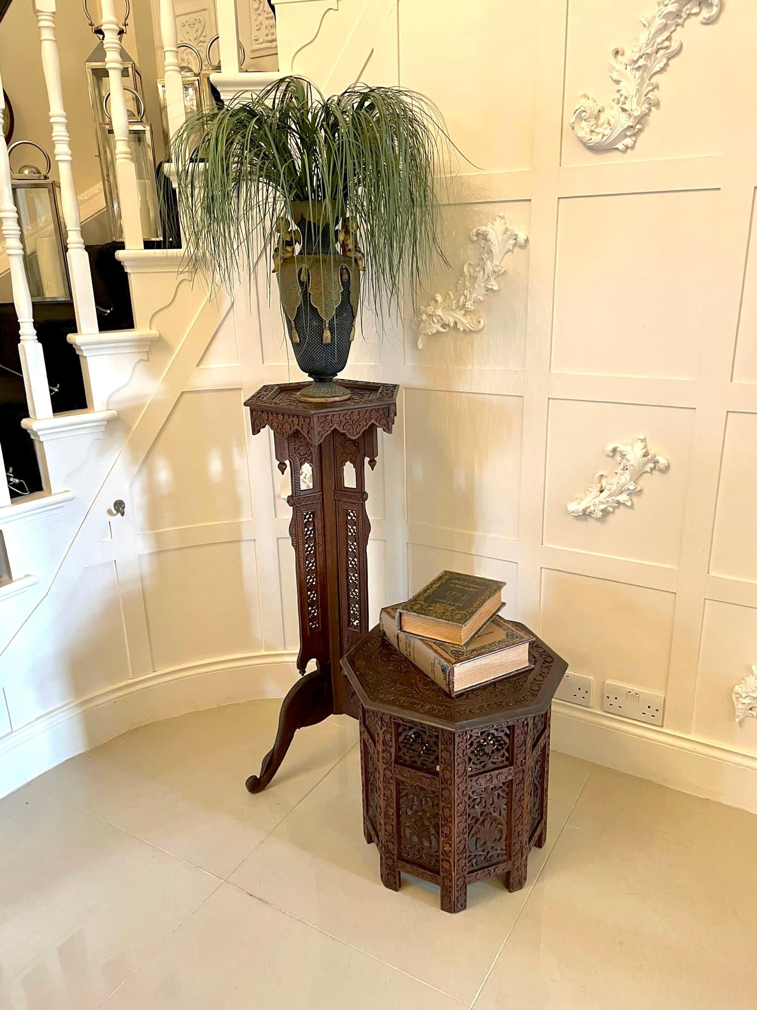 Fantastic quality antique Edwardian carved plant stand having a quality carved hexagon shaped top supported by a marvelous shaped carved piece column raised on stunning carved elephant head shaped cabriole legs with scroll feet.

A very handsome