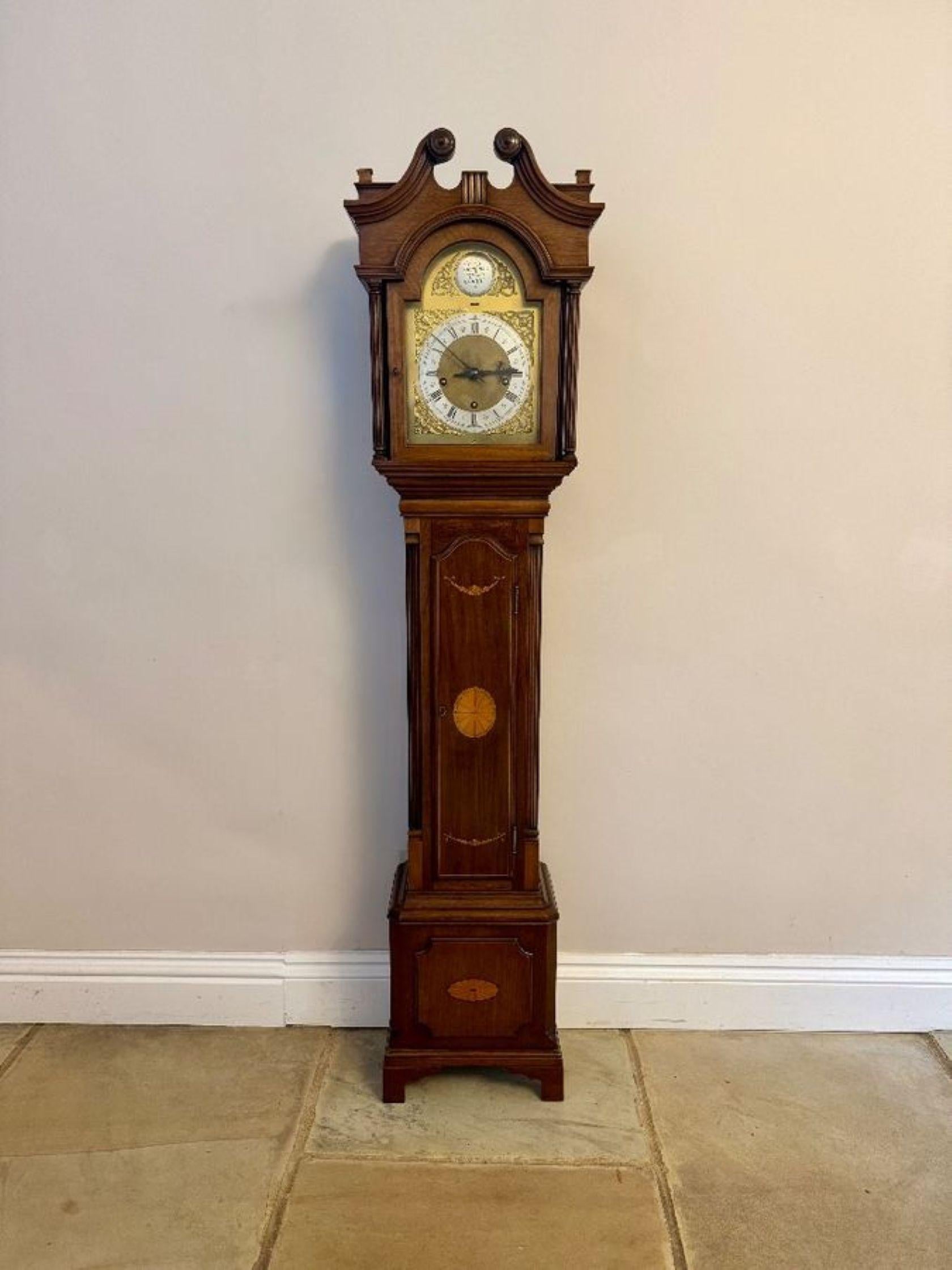 Fantastic quality antique Edwardian mahogany inlaid chiming grandmother clock having a fantastic quality antique Edwardian mahogany inlaid grandmother clock with a brass arched dial with a silvered chapter ring with Roman numerals and the original
