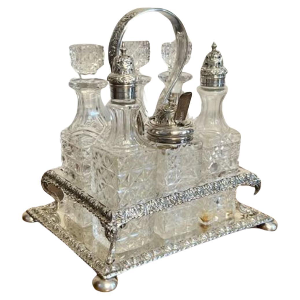 Fantastic quality antique Edwardian silver plated cruet set, having a quality silver plated stand with a shaped handle to the middle, with six original cut glass bottles three with silver plated tops the other with the original square shaped