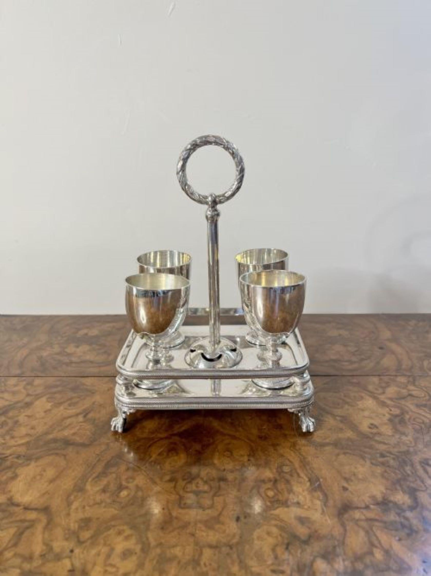 Fantastic quality antique Edwardian silver plated egg cruet set having a fantastic quality antique Edwardian egg cruet set with a quality silver plated stand, an ornate circular handle to the centre, four silver plated egg cups and four silver