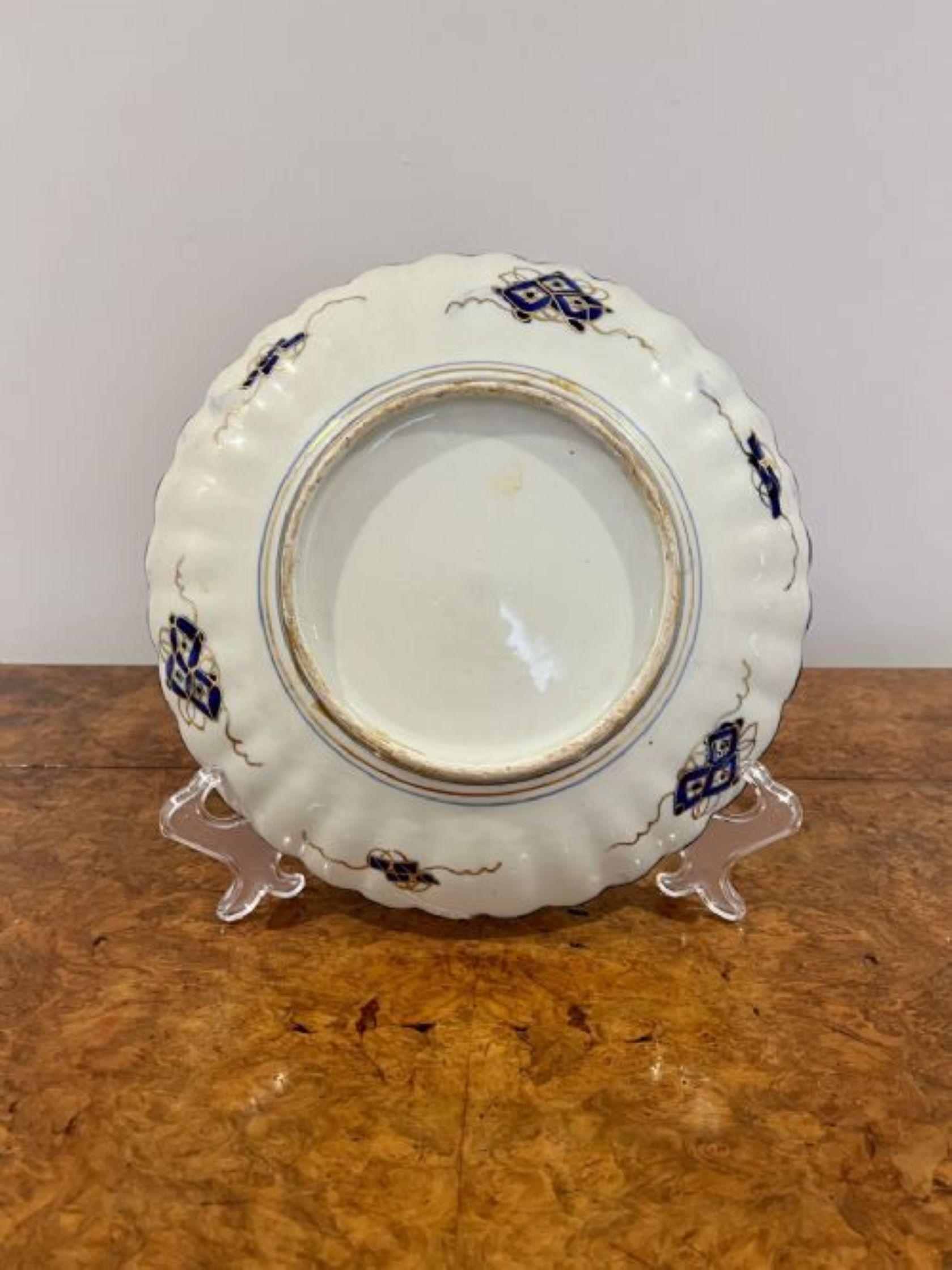 Fantastic quality antique Japanese imari plate with a scalloped shaped edge having hand painted panels to the outside with flowers, leaves, trees and scrolls and to the centre an array of flowers hand painted in wonderful gold, red, blue and white