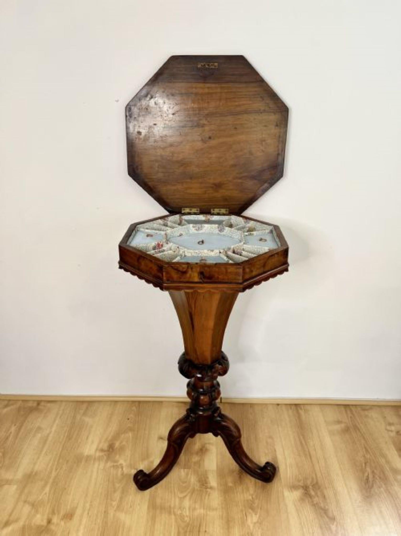 Fantastic quality antique Victorian burr walnut trumpet work table having a quality burr walnut lift up top with a moulded edge opening to reveal a fitted interior, carved walnut freeze shaped storage compartment standing on three shaped carved