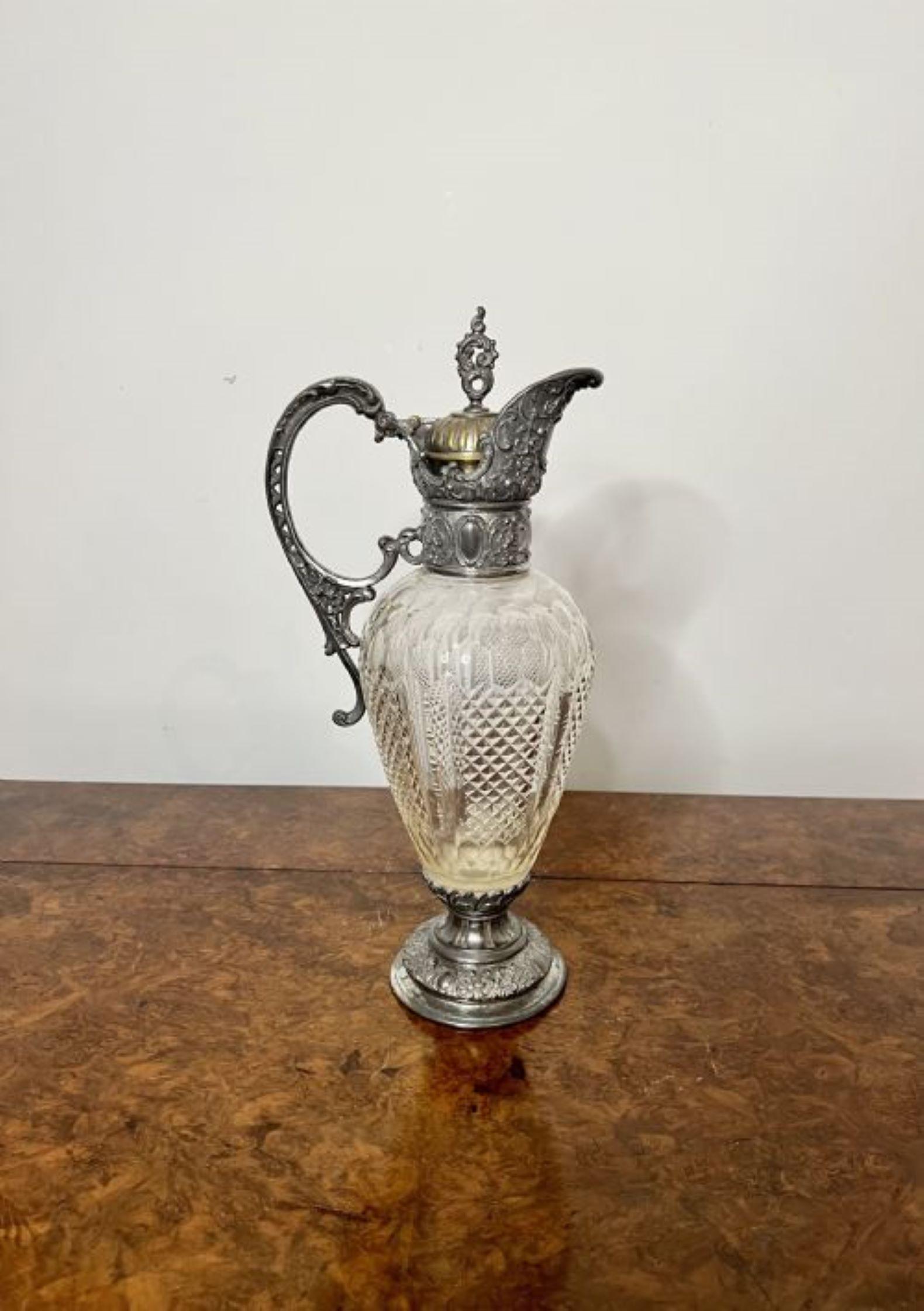 Fantastic quality antique Victorian cut glass and claret jug having a fantastic quality antique Victorian claret jug with a wonderful cut glass circular body with a ornate silver plated shaped handle and spout with fantastic ornate detail standing