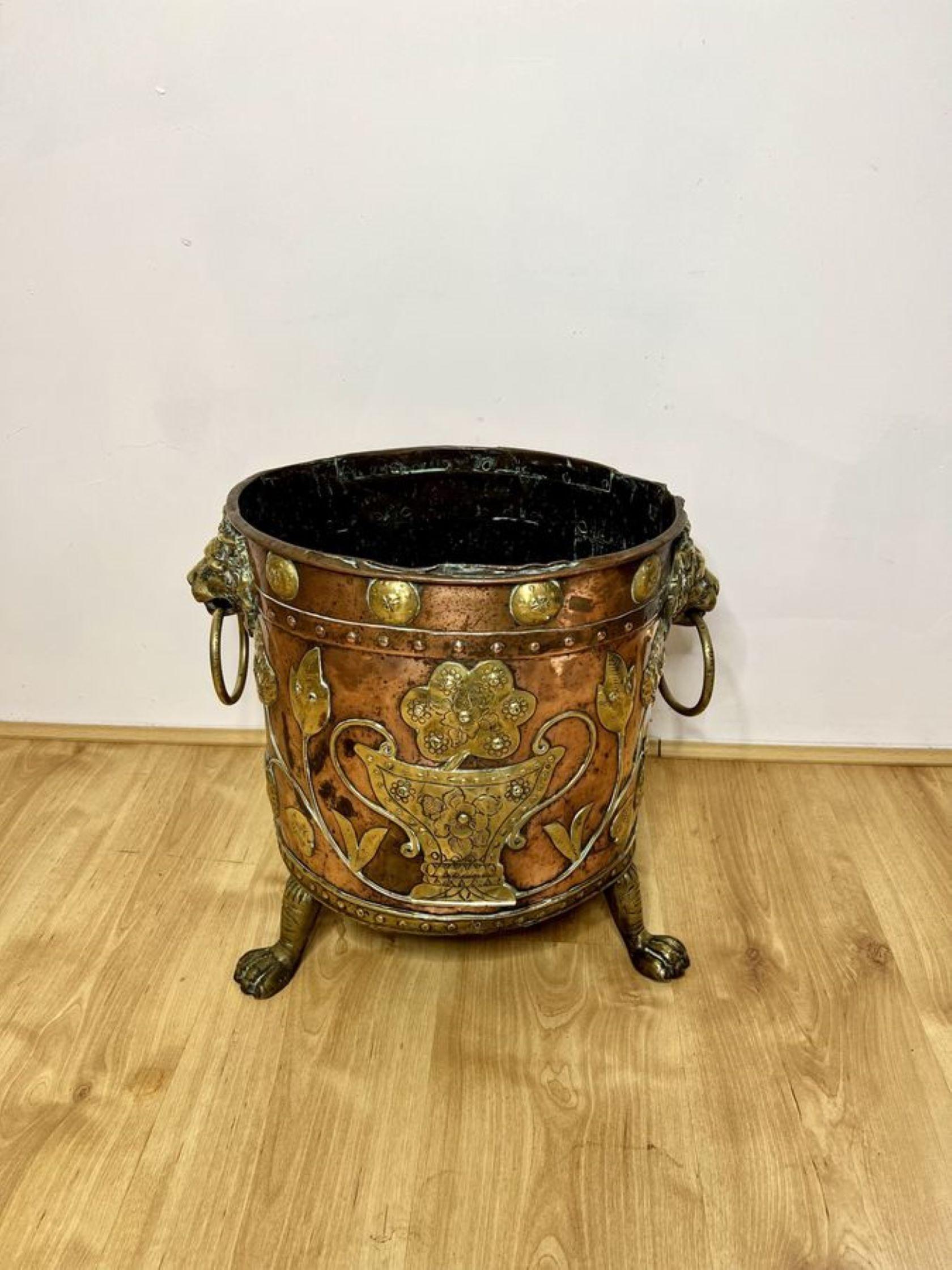 Fantastic quality antique Victorian Dutch copper and brass coal bucket having a fantastic quality antique Victorian coal bucket having a copper ground with brass detail, with brass lion heads ring handles to both sides raised on three brass shaped