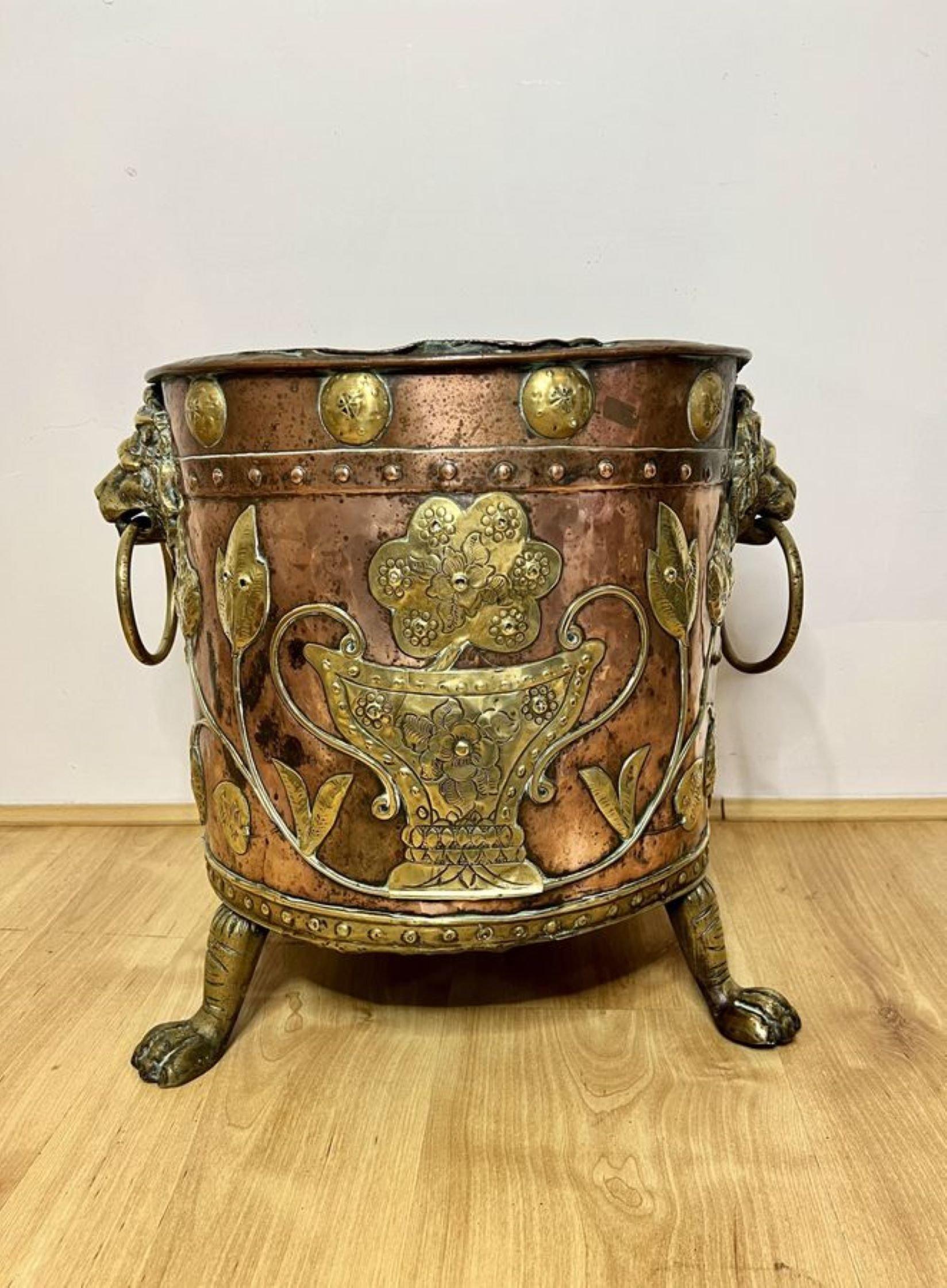 Fantastic quality antique Victorian Dutch copper and brass coal bucket having a fantastic quality antique Victorian coal bucket having a copper ground with brass detail, with brass lion heads ring handles to both sides raised on three brass shaped