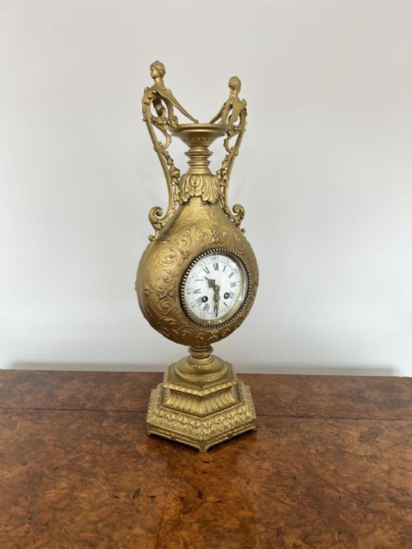 Fantastic quality antique Victorian French ornate eight day striking mantle clock, having a quality gilded ornate shape case, shaped handles with ornate figures to the top, standing on a hexagon shaped stepped base, circular enamel white dial to the