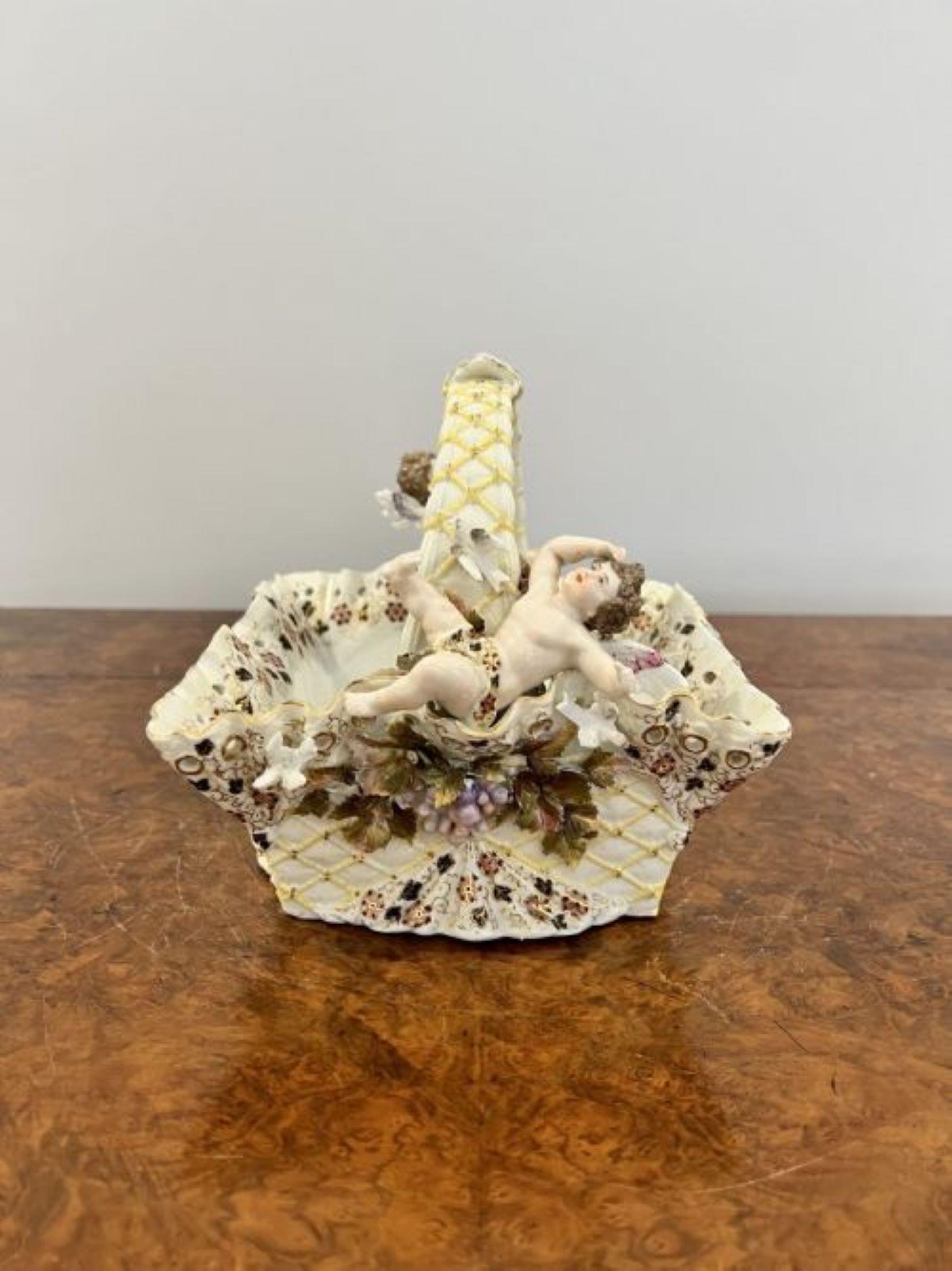 Fantastic quality antique Victorian porcelain basket having a wonderful basket with cherubs to either side of the handle decorated with gilt decoration with doves, flowers and leaves in wonderful pink, yellow, green and orange colours 