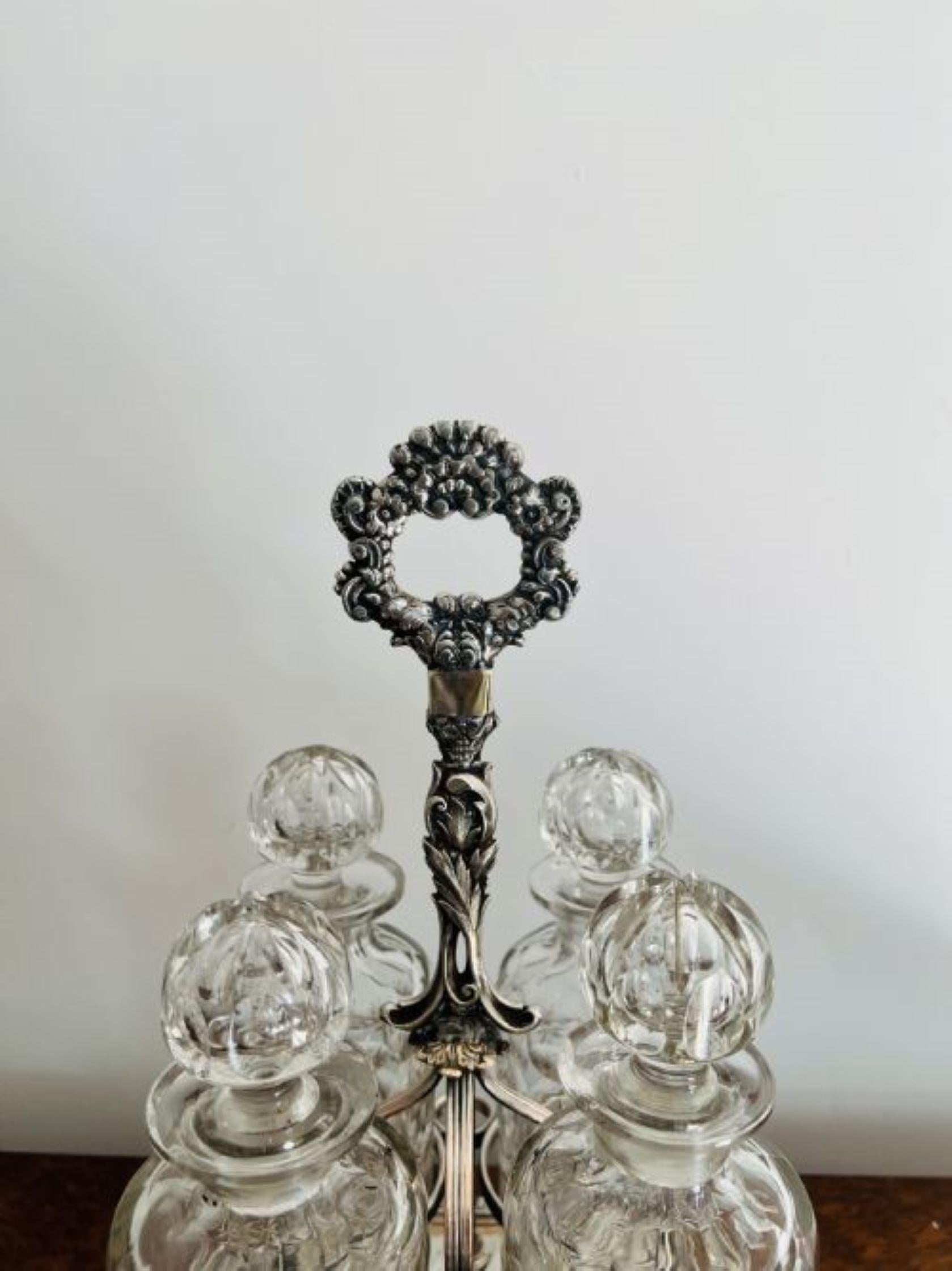 Fantastic quality antique Victorian quality cut glass decanters & original silver plated stand consisting of four quality cut glass decanters all with the original stoppers in a quality silver plate stand, having a ornate handle to the centre,