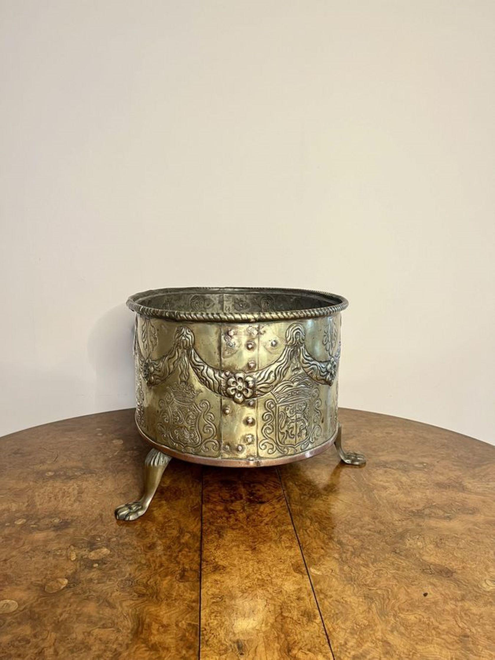 Fantastic quality brass antique Victorian Dutch coal bucket, having a quality embossed brass circular coal bucket raised on three brass shaped paw feet.

D. 1860