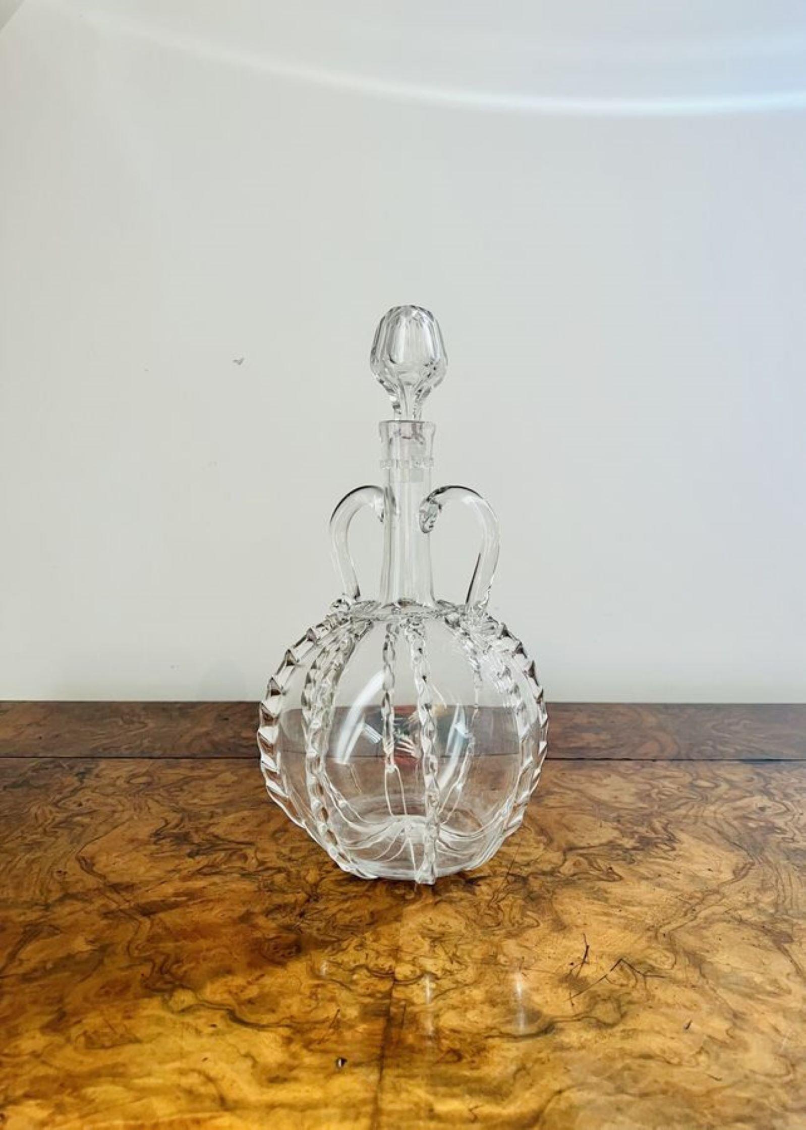 Fantastic quality Georgian Dutch decanter having a circular shaped decanter with rigaree decoration, twin handles to the neck and a glass stopper.
Minor damage to the decretive glass to the back as shown it does not affect the use of the