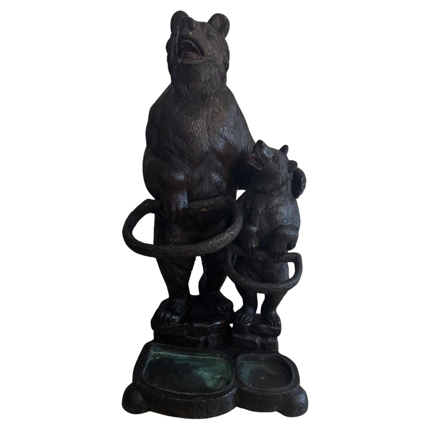 Fantastic quality large antique Black Forest carved bear double stick stand