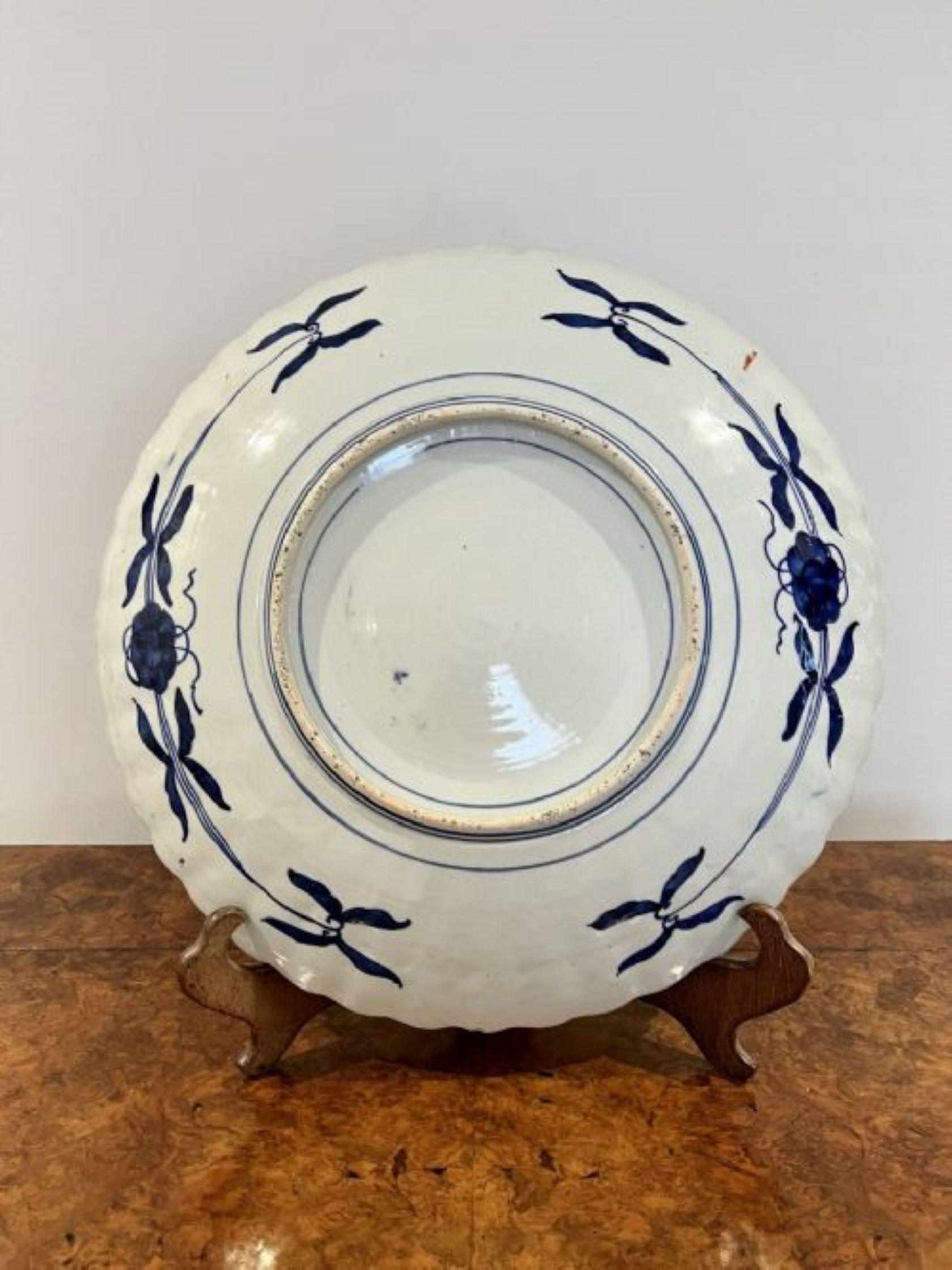 Fantastic quality large antique Japanese Imari plate having a fantastic quality Imari charger with a scalloped shaped edge, fabulous hand painted centre decorated with a basket of flowers surrounded by panels decorated with flowers, leaves, trees,