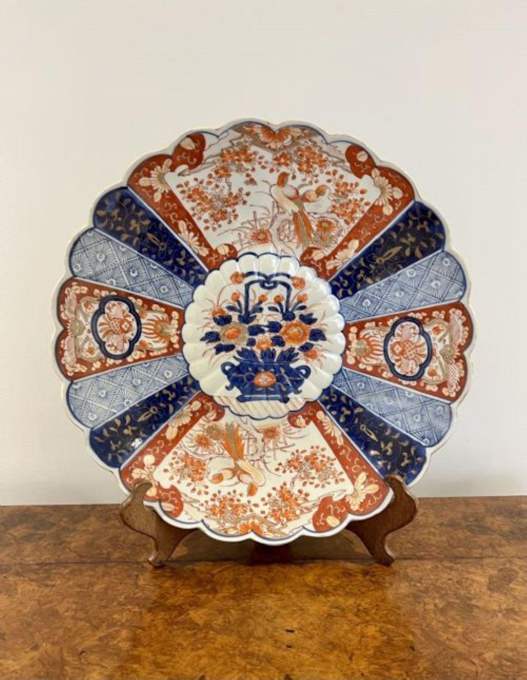 Fantastic quality large antique Japanese Imari plate having a fantastic quality Imari charger with a scalloped shaped edge, fabulous hand painted centre decorated with a basket of flowers surrounded by panels decorated with flowers, leaves, trees